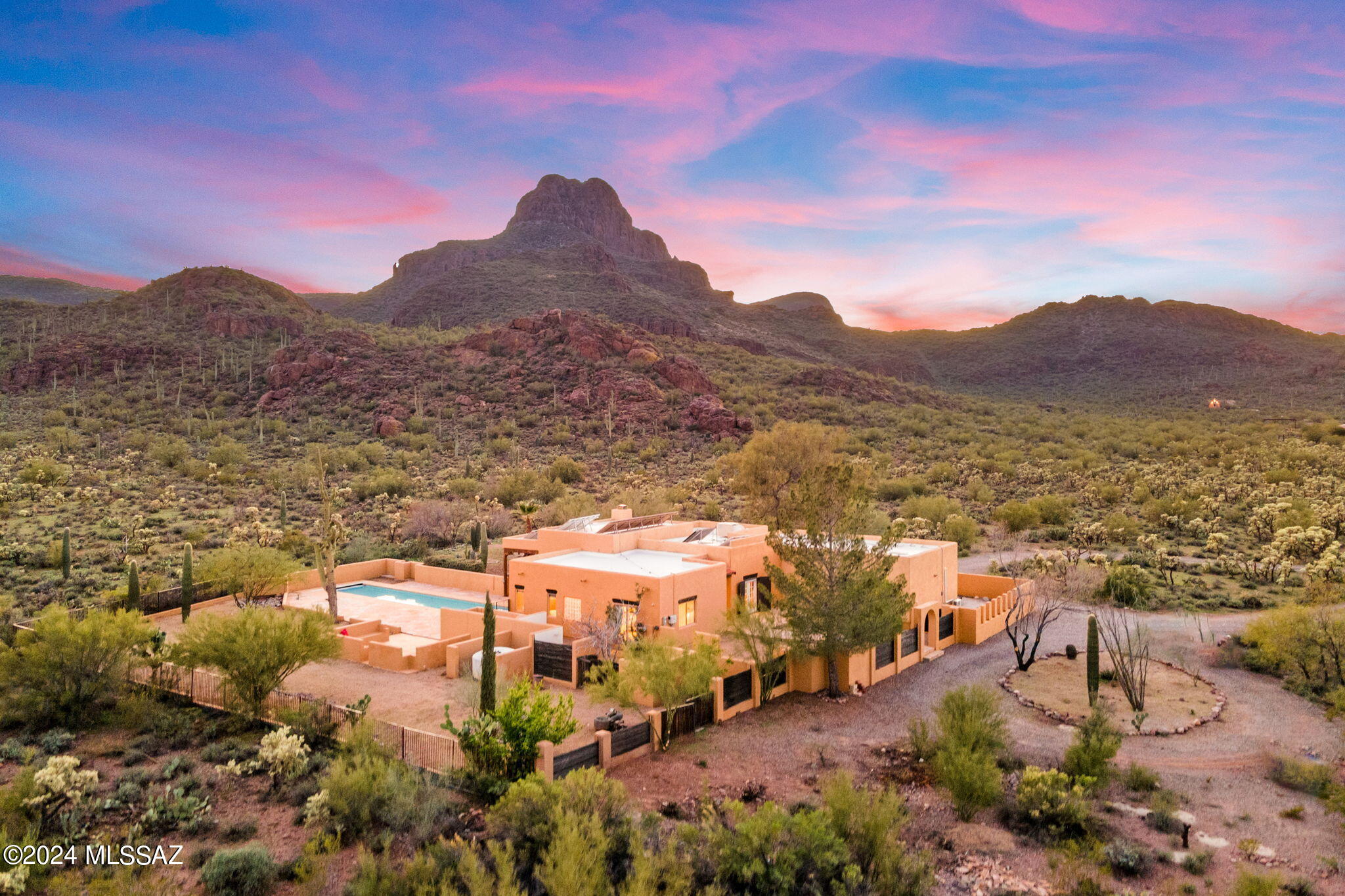 Embrace the magic of the Sonoran Desert at this hidden gem bordering Saguaro National Park. This 3.35 acre horse property recalls an era of secluded luxury guest ranches with the lap pool, guest casita, abundant covered patios, and stunning mountain and desert vistas. With no HOA, recoated roof, and new water heater, this property is ready for your personal touches. Discover the endless potential this extraordinary property has to offer.