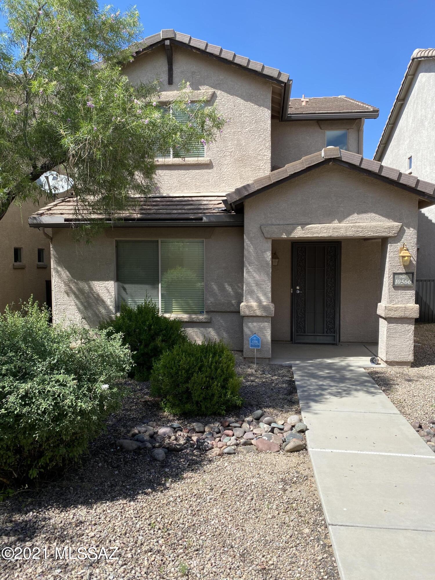 GREAT home located in SIERRA MORADO...the perfect spot in Tucson and in the AWARD WINNING VAIL SCHOOL DISTRICT.  Close to shopping, biking trails, walking trails, Sahuaro National Park, I-10, hospitals...the list goes on and on.  What a great forever home, starter home or make it a vacation home. Sierra Morado offers a wonderful park with a huge community pool, lovely club house and a great sense of ''community'' overall.  This is a large two bedroom two and a half bath home. Master bedroom has a huge bath with double vanity, second bedroom is very large and down the hall.  Half bath is located downstairs for easy access.  Nice open floor plan with the kitchen looking into the great room. Home has lots of natural light and storage. Solar is owned and for water only.