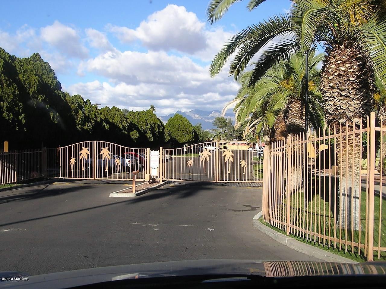 Fresh Paint, New Carpet, Sweet West side 2 bedroom condo in a gated community with your own little yard! A quick jaunt to downtown, U of A, Pima Community College, and within walking distance of St. Mary's. Bright and open floor plan. 24 hour gated access community features a pool and spa. Wont last long!