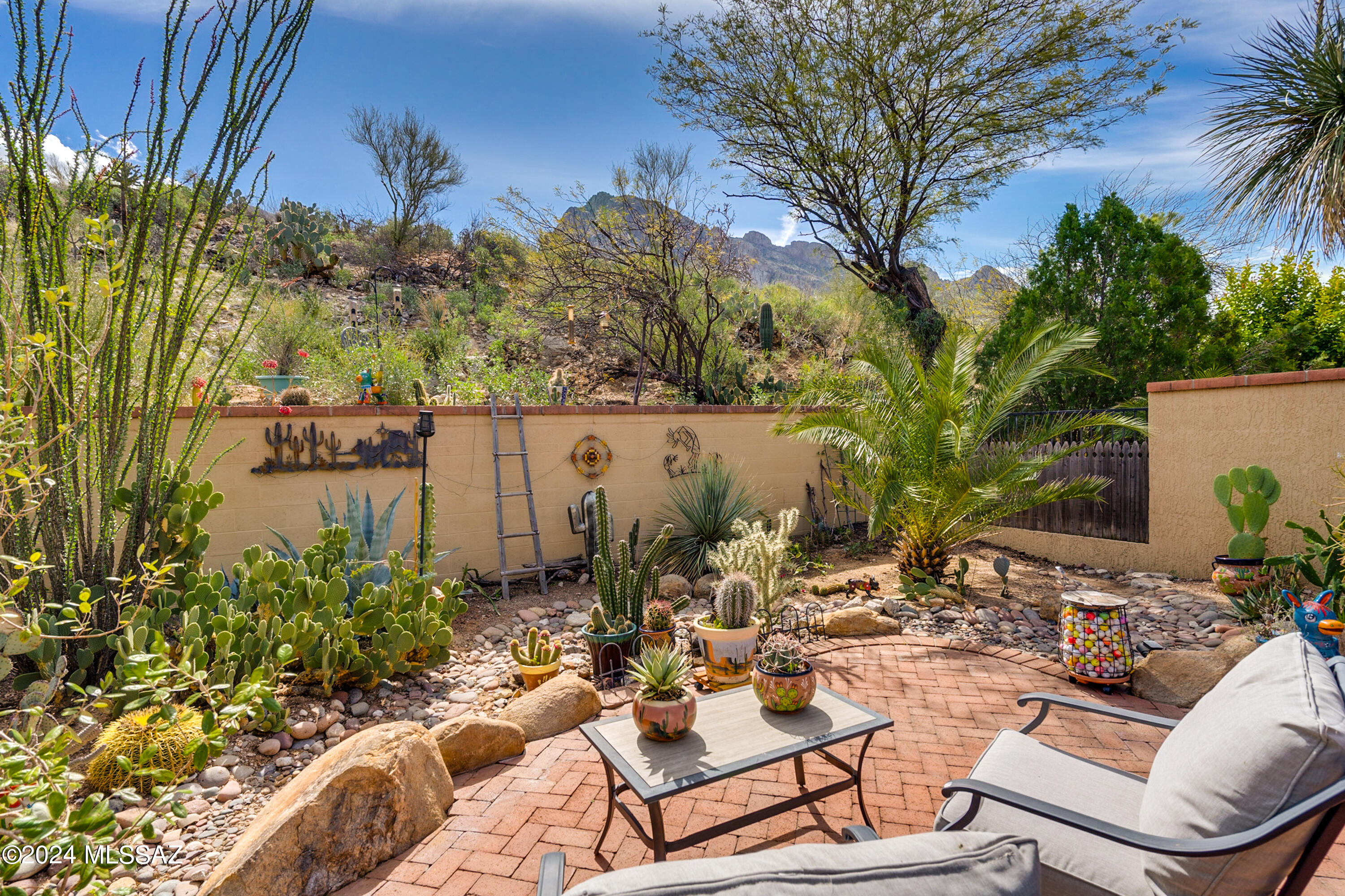 Views & Privacy! Desirable El Conquistador Patio Home adjacent to the Hilton El Conquistador Resort. Nestled at the base of Pusch Ridge, this 1453 sq ft patio home features 2 spacious bedrooms and 2 full bathrooms. Light & bright kitchen with granite counter tops and ample cabinetry. Delightful breakfast area that opens to a covered private patio. Spacious living room open to dining room. Attractive tile throughout. Enjoy Gorgeous Pusch Ridge Mountain Views from the Relaxing Private Patio Retreat. End unit bordering common area. This Delightful Home is Light & Bright and Truly Move-In Ready! Resort Style Living awaits you!