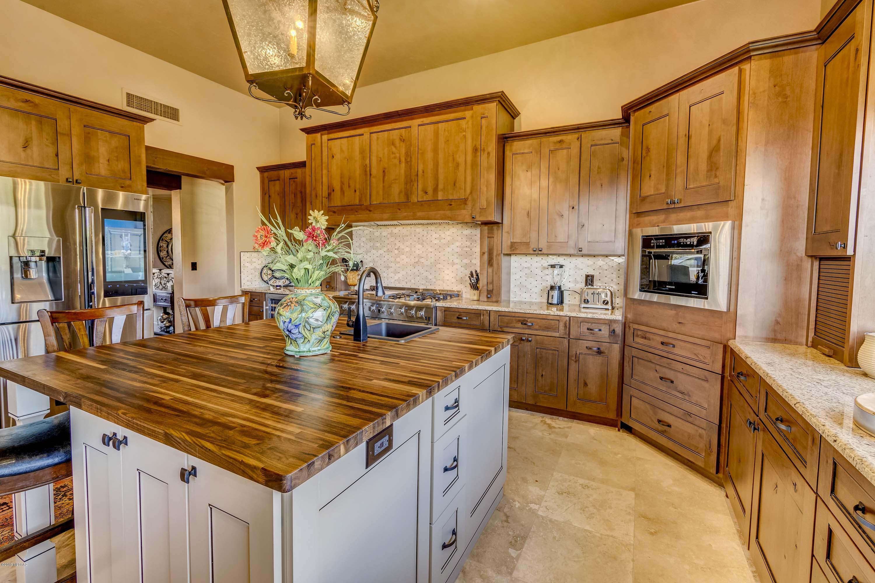 TAR Home Tour winner. Spectacular mountain views, top notch renovation inside and out on 2+ acres above Ventana's 9th fairway. Corporate owned, Must Sell! New cabinets throughout. All new doors and windows. New travertine and carpet flooring throughout. Top of the line Kitchen Appliances. Granite counter tops in kitchen, bath & laundry rooms. All new toilets, sinks, faucets, showers, vent fans, & ceiling fans. Custom interior/exterior lighting. 2 Rheem heat pumps 8/18, Smart thermostats. Smart H2O heater. Extensive Exterior Upgrades: Pool plaster/tile & filter, paint, roof maint, paver driveway, garage doors. extended yard, synthetic grass, planters & watering system, decomposed granite, Custom, remote operated exterior privacy gates.  + More. NO HOA or gate fees/restrictions! Owner/Agent