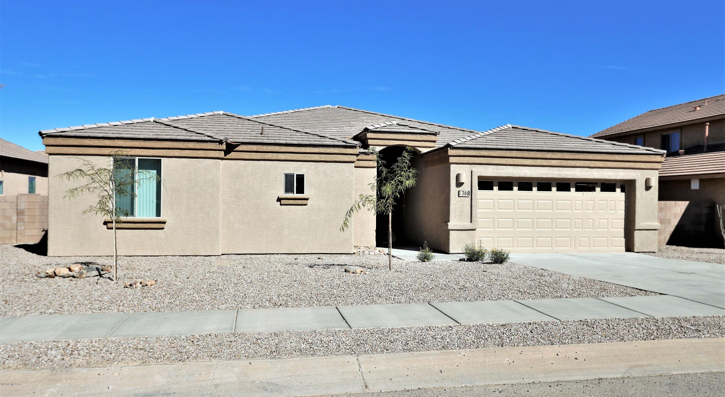 Newly constructed custom 4 Bedroom home, located in Corona De Tucson, Finished in 2018!! Spacious open floor plan, upgraded kitchen, custom poured and stained flooring and personality galore.  Truly a picturesque setting with low maintenance landscaping. Add to this... 2 baths, tons of storage and a fully finished 2 car garage! Make this home yours today!