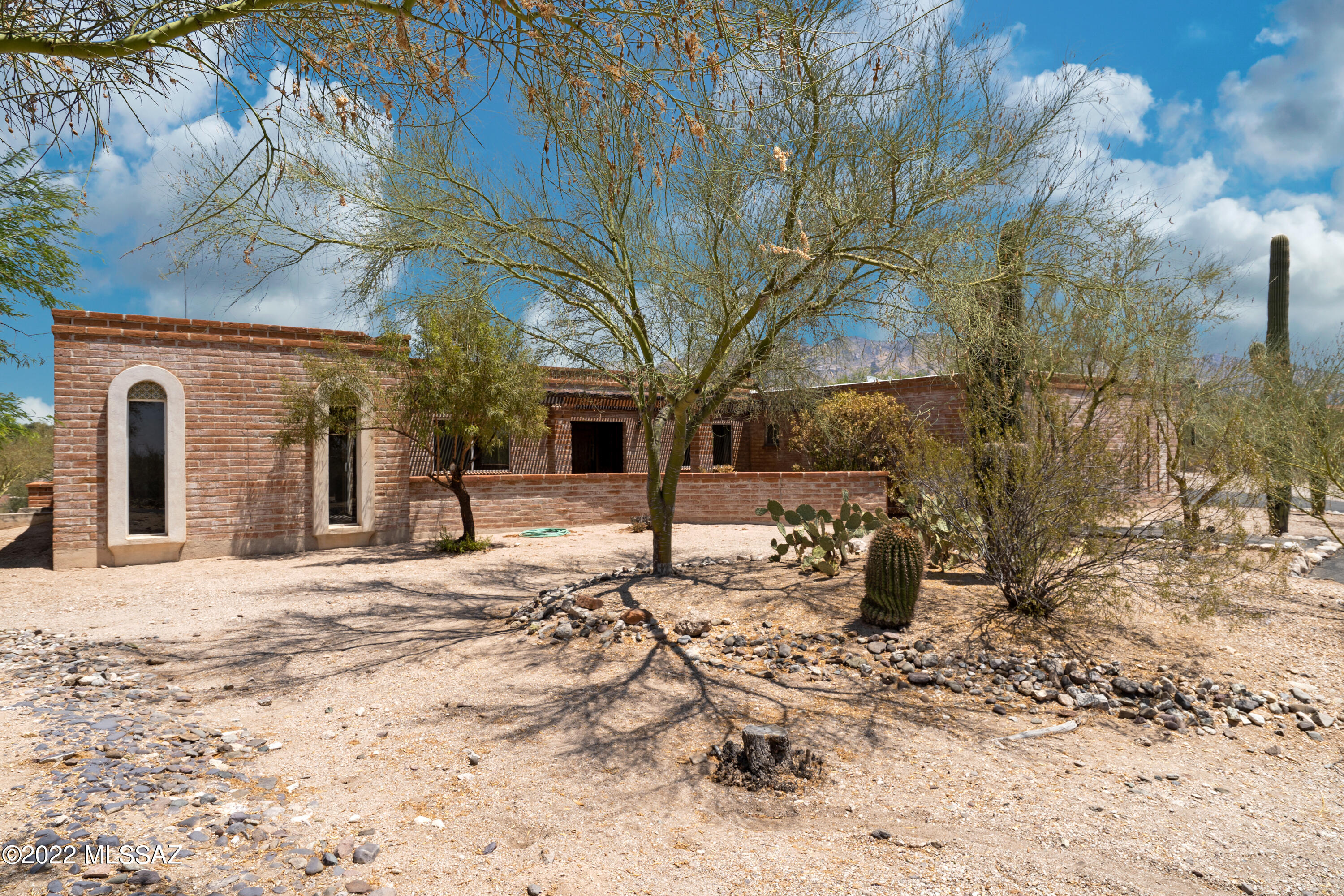 Incredibly rare opportunity to own a classic Tucson burnt Adobe Territorial in the Catalina Foothills and adjacent lot. Both properties have extraordinary mountain views and are situated at the end of a cul de sac. This single owner home
retains many vintage details, two fireplaces, and offers four bedrooms as well as two & a half baths. Two car garage, large plaster pool, and low HOA make
this a great property to improve upon or simply enjoy. Just minutes to St. Phillips plaza, the University of Arizona, or La Encantada.