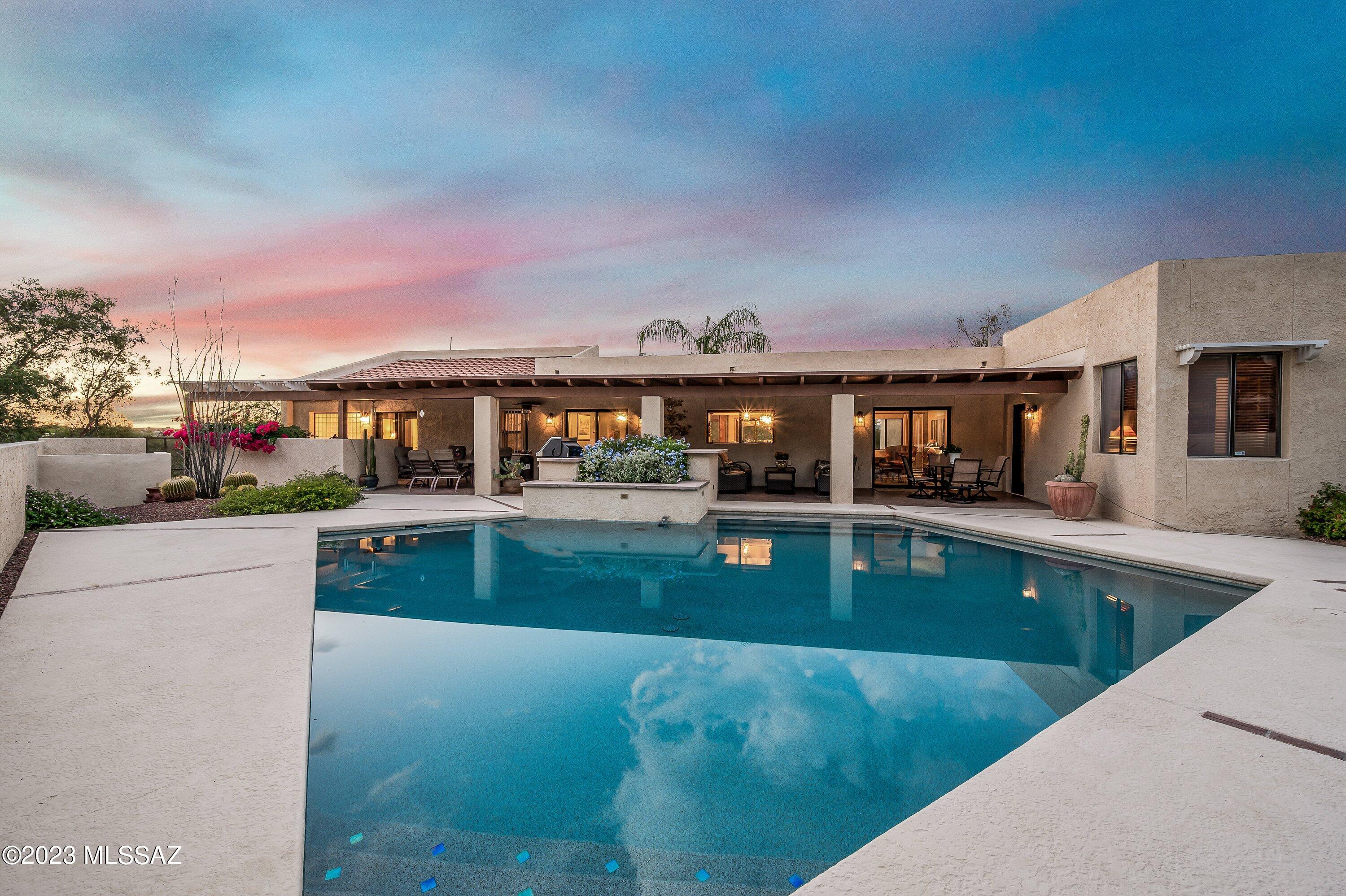 Discover Your Oasis! Custom Masonry Home with Resort-Style Living. Nestled on 1.72 acres of prime Tucson real estate, this exceptional custom-built masonry home offers unparalleled comfort and luxury. Boasting 4 spacious bedrooms and seamless indoor-outdoor living, this residence perfectly blends elegance with ease. Enjoy stunning views of the Omni Tucson National 36-hole golf course from the comfort of your own home.
Direct access to the golf course and country club via a convenient golf cart path.
Resort-Style Backyard: Relax and entertain in your private backyard haven featuring a sparkling pool and ample space for lounging. Revel in picturesque mountain vistas that add a serene backdrop to your daily life.
Spacious 3-Car Garage: Plenty of room for your vehicles and additional storage. Experience easy Tucson living with close proximity to shopping