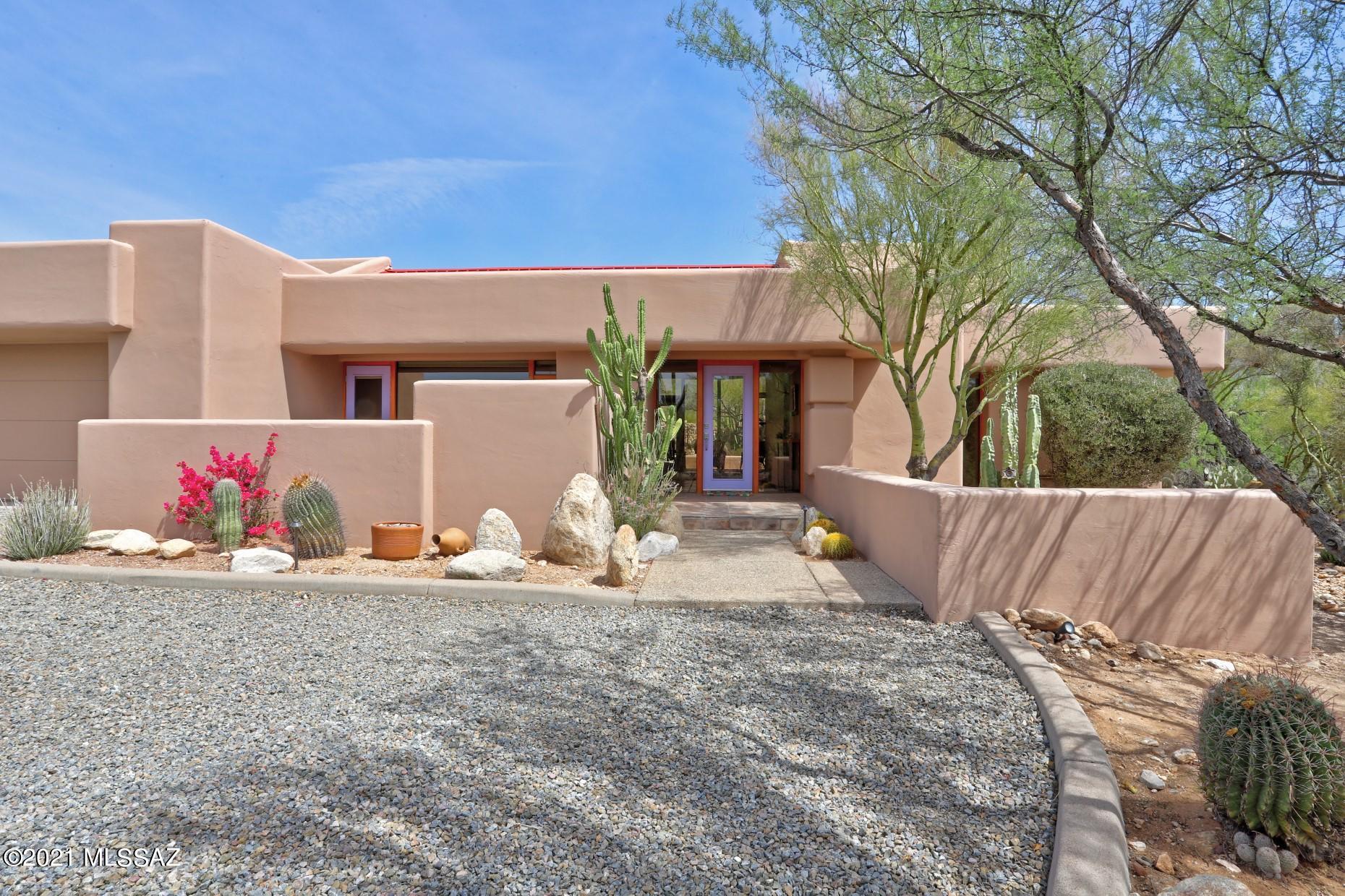 The One You've Been Waiting For! Classic/Timeless Tyson-Murphy Home in Heart of Foothills.  Private 
tucked away in enclave of 7 homes architects built in 90's.  All the trademark features Ã¢â‚¬' ceiling to floor windows, built-ins, views every window & multiple fireplaces.  1 story/approx.1 acre/3 beds/3 baths/2 car garage Ã¢â‚¬' 2649 sq.  Outstanding mtn views in back w/heated lap pool, spa, outdoor speakers & stucco ramada. Circular drive, front courtyard patio, N/S orientation cul-de-sac.  Home surrounded in natural desert + extensive professional landscaping of distinctive cactus specimens. Vaulted ceilings w/beams & canned lighting. Compelling spaces for art. Split bedroom, Saltillo public spaces/ carpet in bedrooms. Dual cooling, nest thermostat & alarm.  Spacious kitch cabinets, Dacor double oven & 5 burner gas cooktop, built-in Sub-Zero refrigerator,  upper cabinets have glass fronts, island & desk area.  Walk-in pantry, laundry w/cabinets, counters & sink.  Rolled & metal roof, storage room in garage +peg board/work bench. Just a mile away from great restaurants & shopping. A quick drive to U of A and Downtown! Living the Tucson lifestyle!