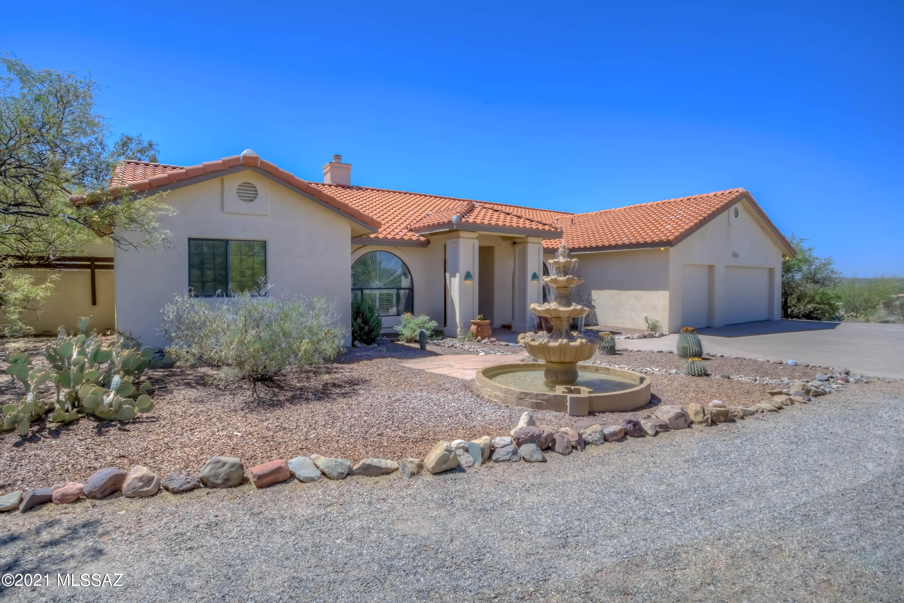 Amazing equestrian custom home on over 4 acres in prestigious La Cebadilla Estates with panoramic Rincon Mountain views & direct access to TV Wash & Saguaro National Park riding trails. Chef's gourmet open kitchen (gas), oversized master suite, concrete floors, large 3 car garage, open/split floor plan. Exceptional property is peaceful, private & versatile. Outdoor entertaining – expansive flagstone patio, sparking pool/spa. New roof underlayment with warranty, owned solar with warranty, new concrete overlay floor throughout & master closet (2021). Newer pool pump/heater (2019). Horse property w/ multiple stalls, tack room, hay barn, arena & dog runs. Community catch/release lake. Tucson's best riding, cycling, hiking & bird-watching! Tanque Verde School District