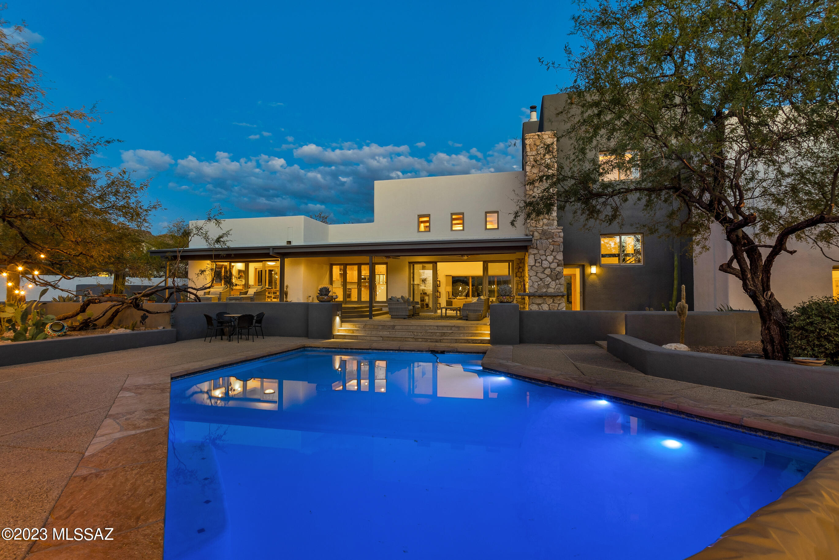 Welcome to your dream desert oasis! This one-of-a-kind home offers an experience like no other, boasting breathtaking 360-degree views of both sunrise and sunset against the stunning backdrop of majestic mountains. Nestled on approximately 3.5 acres, this property promises tranquility, privacy, and endless opportunities for outdoor enjoyment without restrictions of an HOA.

As you step inside, you'll immediately be captivated by the unique stone accents throughout the home, all sourced from the very ground on which this home was built. The natural beauty of the stone seamlessly blends with the warm and inviting interior spaces, creating a connection to the natural surroundings. Architectural marvel awaits you with a striking feature - helicopter blades extending from floor to ceiling, adding a unique and modern touch to the living space.

With sustainability in mind, this home is equipped with owned solar panels and 3 brand new HVAC systems, ensuring energy efficiency and reduced utility costs. The custom solar pool cover helps keep the heat in, allowing you to enjoy the relaxing saltwater pool year-round even during the cooler desert nights.

Sports enthusiasts will appreciate the private pickleball court, while equestrians will enjoy the horse facilities including stalls, coral and tack room. Horse trails nearby give you easy access to saddle up and go! 

Multiple view decks and patio areas provide the ideal settings for outdoor entertaining and relaxation. You can savor the flavors of outdoor cooking with the built-in BBQ, gather around the firepit for cozy evenings, and enjoy the soothing sounds of the water feature.

For those with a passion for cars and hobbies, the huge 5 car or 4 car plus RV garage with a workshop and bonus area offers endless possibilities, whether you choose to use it as a studio, rec room, or workout space. 

Located at the East end of Tucson, this home is a hiker's paradise, with easy access to the region's scenic trails allowing you to explore the natural beauty of the Sonoran Desert right from your doorstep. Agua Caliente park and trailhead are just minutes away! If you've been dreaming of a home where every day feels like a vacation, this is your opportunity to turn that dream into reality. Don't miss out on this unique desert retreat - schedule your viewing today and experience the epitome of desert living!