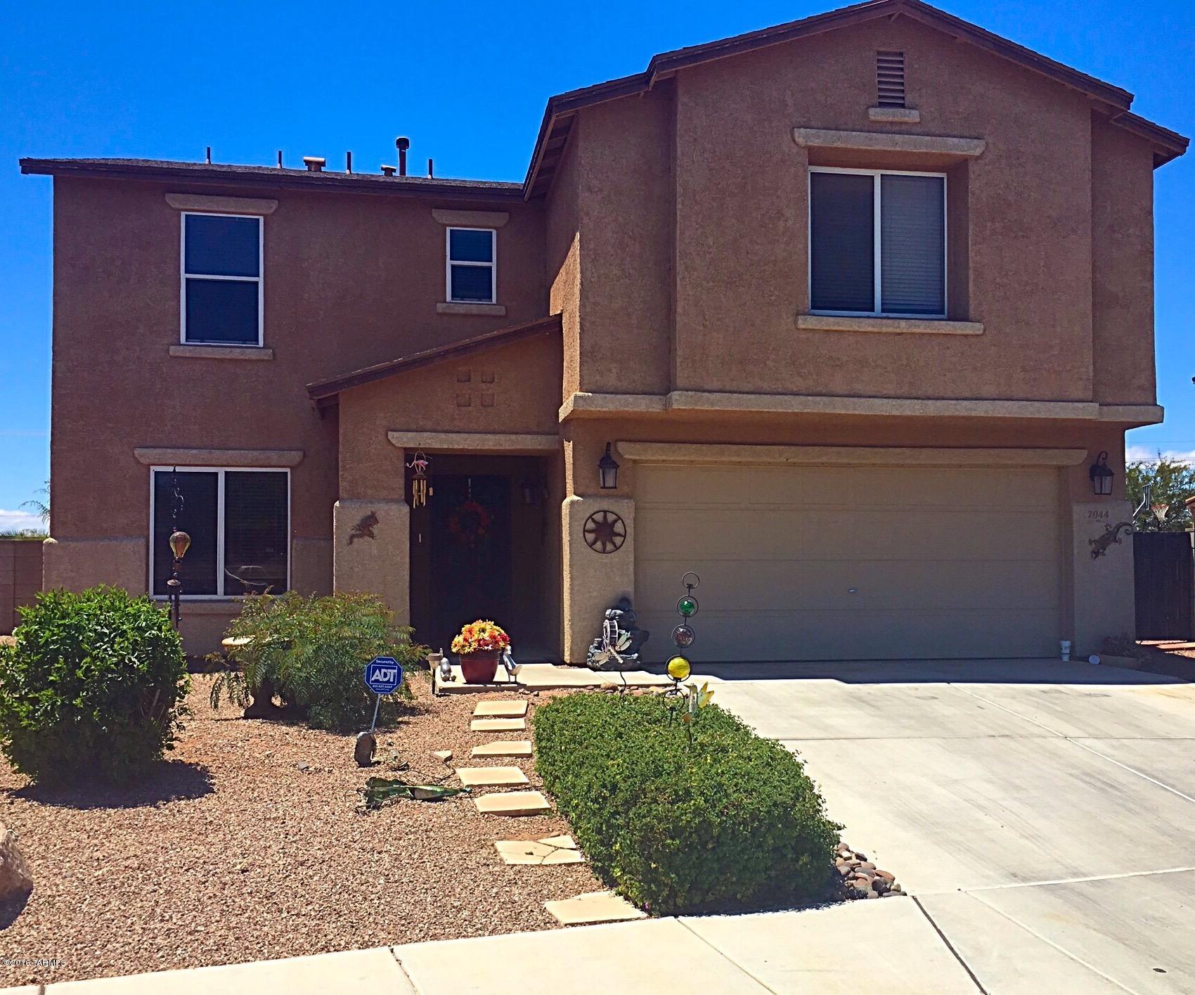 This spacious 2 story is the largest floor plan in the neighborhood! Well maintained with upgraded travertine tile, carpet, laminate, travertine counter tops and fire place. Dual zoned central AC. Large lot, irrigation system, plenty of room for pets, friends and family both inside and out! Above ground pool and gazebo offered as is. This home backs up to common area providing extra PRIVACY with no homes directly behind lot, must see!