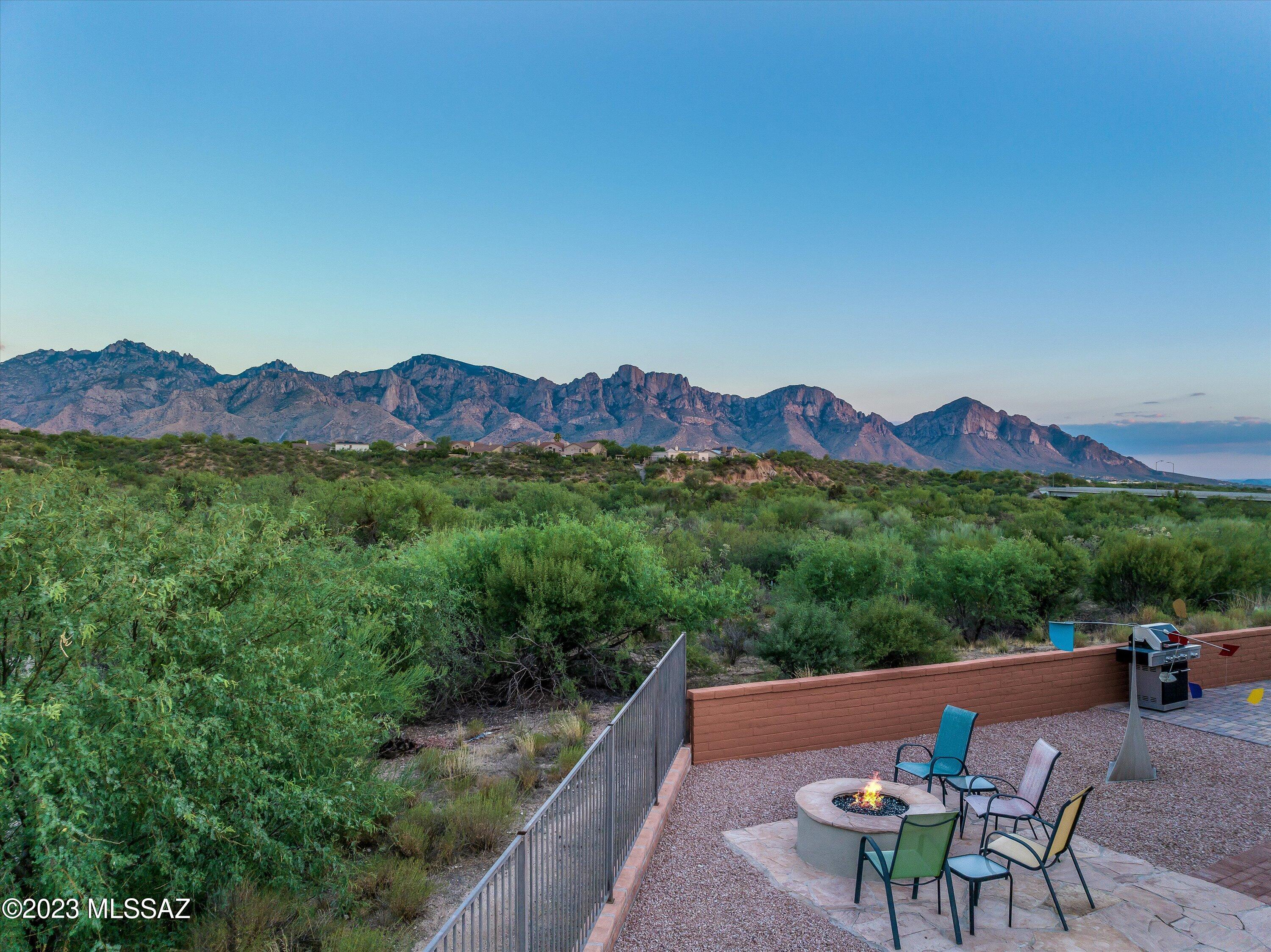 Welcome to this stunning 2 bedroom, den, 3 bath home with breathtaking 180° views of the Santa Catalinas. This fully updated property offers a spacious 2495 sq ft of thoughtfully designed and meticulously renovated living space. Nestled on a generous quarter acre lot, this home offers ample space for outdoor relaxation. The interior has been carefully crafted, leaving no detail untouched. You'll find a modern kitchen with premium appliances, elegant quartz countertops, oversized island, and ample storage, creating a chef's dream. Separate living and dining areas, with large windows for natural light and to showcase the mountain views. Embrace the natural beauty and experience a lifestyle of serenity, luxury and comfort. Don't miss out on this spectacular home. Schedule your viewing today!