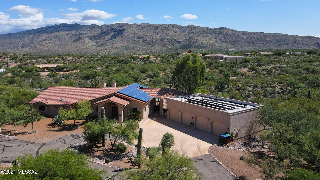 Spectacular mountain views from this beautifully remodeled home tucked way back off the road enhancing the amazing peace and tranquility you'll find here.  Greatroom offers sky-hi ceilings, dramatic FP & a wall of windows framing the views. Kitchen is open to the greatroom w/rich cabinetry, gorgeous granite and huge island. Separate formal dining room for those special occasions. Huge owner's suite w/more views, sitting area w/FP, huge closet & en-suite bath has dual vanities & lovely walk-in shower. Backyard features a covered patio, raised deck and a sparkling pool w/Baja shelf & waterfall. Amazing 4 car garage has a fabulous hobby room, plenty of space for all your toys! New flooring, Office/den w/built ins, paid in full solar lease.  Close proximity to Sag Nat Park! See agent remarks.