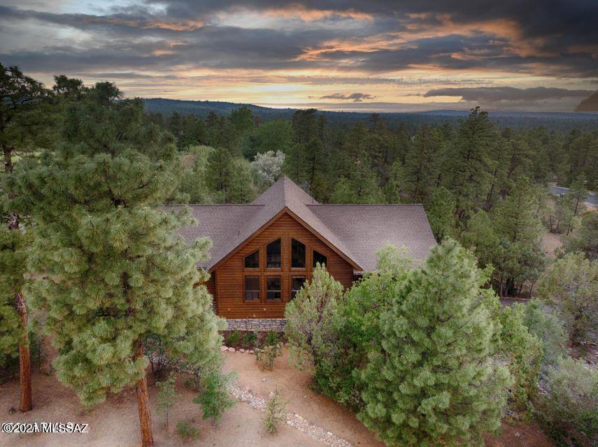 Breathtaking views and sunsets in your fabulous new cabin in the woods! Located in the highly sought-after area of Torreon, come see the home that will check off all YOUR boxes. On the main living floor you are greeted by treetop views with plenty of natural light to enjoy the surrounding forest, all while offering complete privacy. The generous-sized kitchen invites you to come together with  family and friends and still have plenty of room. The Owners suite is located on the main living floor with a private entrance to the hot tub ,that awaits you, on the back porch or you could choose to relax in your large oversized soaking tub in the ensuite. In addition, a guest bedroom and Den are on the main living floor with a guest bathroom available. Upstairs in the loft area, enjoy a game of pool or create a special retreat to watch the breathtaking sunsets from.  Downstairs is the perfect area to offer to friends and family where they will find a private bedroom and ensuite plus a spacious living room area and private covered patio to enjoy the chilly nights by the firepit.  With so much to offer, this home will be gone before you know it. Most furnishings available.  Showings available starting Saturday, June 19th. Seller requests occupancy in home until October 1st, 2021."