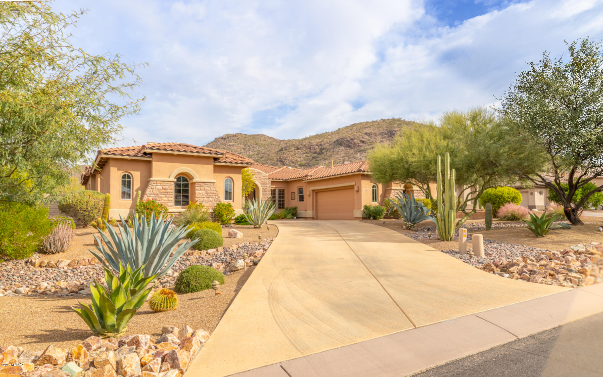 HIGHLY SOUGHT OUT GALLERY PARCEL HOME IN GATED SOLANA AT DOVE MOUNTAIN! When you are looking for the best. Stunning 4BR/3.5BA + DEN Toll Brothers home. Wonderfully situated with VIEWS of the Tortolita Mountains. GREAT ROOM plan w/VIEWS, Dry Bar w/Beverage Cooler. Gourmet Kitchen includes Granite Counter Tops, Tile Back splash, 42'' Dark Wood Cabinetry, Incredible SS Appliance Package and 3 Costco-Trip Pantry. You'll love the Master Bedroom Suite w/Sitting area, Stone Face Gas Fireplace; Luxurious Bath w/Split Granite Topped Vanities, Jetted Tub, Large Tiled Walk-In Shower and Dual Walk-In Closets. Separate Guest Wing Includes 3 Spacious Bedrooms and 2 Guest Baths. All Rooms include Custom Ceiling Fan/Light Fixtures. Covered Patio leads to Saltwater Pool w/Waterfall & Slide, Hot Tub, Grilling Station, Fire Pit, Lush Landscaping includes Fruit Trees to pick your own. Wonderful VIEWS of the Tortolita Mountains. A true Move In Ready DREAM HOME.