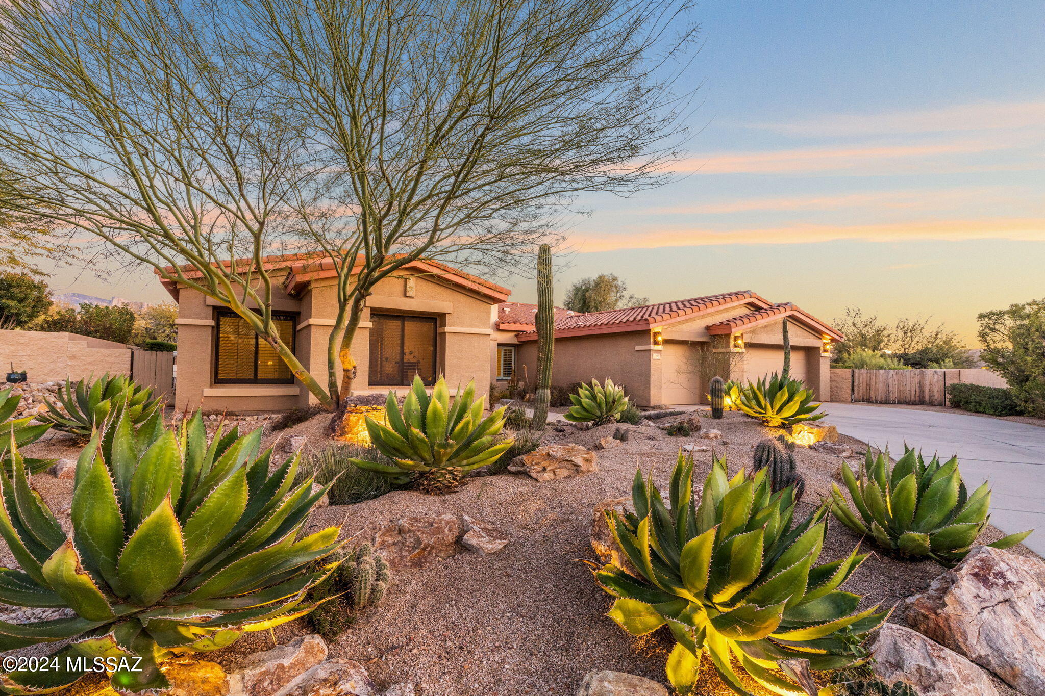 Spectacular 4BD/2.5BA (3,210 sq ft) Contemporary on almost .4 acre cul-de-sac lot boasts East facing views, heated/saltwater pool & spa plus newer Roof & HVAC. Enter to find a formal living space plus large, open Den. Gathering room beyond hosts a fireplace and sleek gourmet kitchen w/ center island, SS appliances, plus expansive cabinetry & slab stone countertops. Gorgeous wood plank flooring, plantation shutters and picture windows. Private Owner's suite off patio showcases large bay window and luxury bath w/ soaking tub, custom tiled walk-in shower & custom closet. 3BD's, full bath + powder room off far hallway. 3 car garage w/ 4' extension. Retreat to a resort style yard boasting covered main patio, BBQ, large side patio, gated pool w/ raised spa, lush landscaping & Pusch Ridge views!