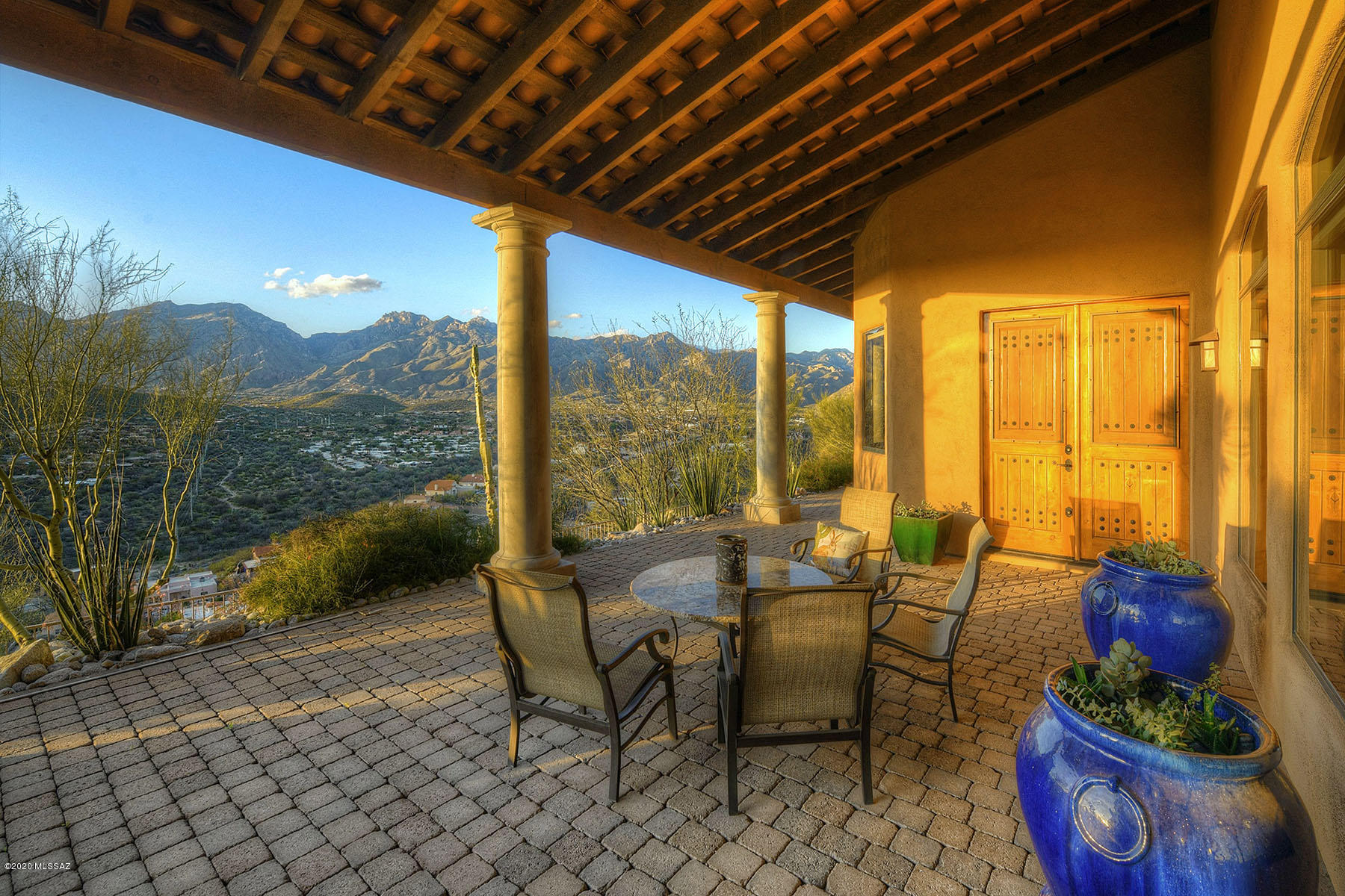 Stunning southwestern contemporary high on a ridge ''above it all'' in a private, gated community of only six homes in Sabino Mountain with ''reach out and touch the mountains'', valley below and Tucson city views.  Located behind a second gate and on a cul-de-sac, courtyard entry into foyer reveals a plethora of custom, upgraded, meticulously maintained features including soaring ceilings, walls of windows, custom quartz floors, knotty alder doors and corner fireplace with custom mantle in living room.  Formal dining room, then Chef's kitchen with granite counters, center-island, designer SS appliances including gas cooktop, all opening to expansive breakfast area and family room.  Gracious master suite has dual vanities, dual walk-in closets and custom alder door to rear patio.