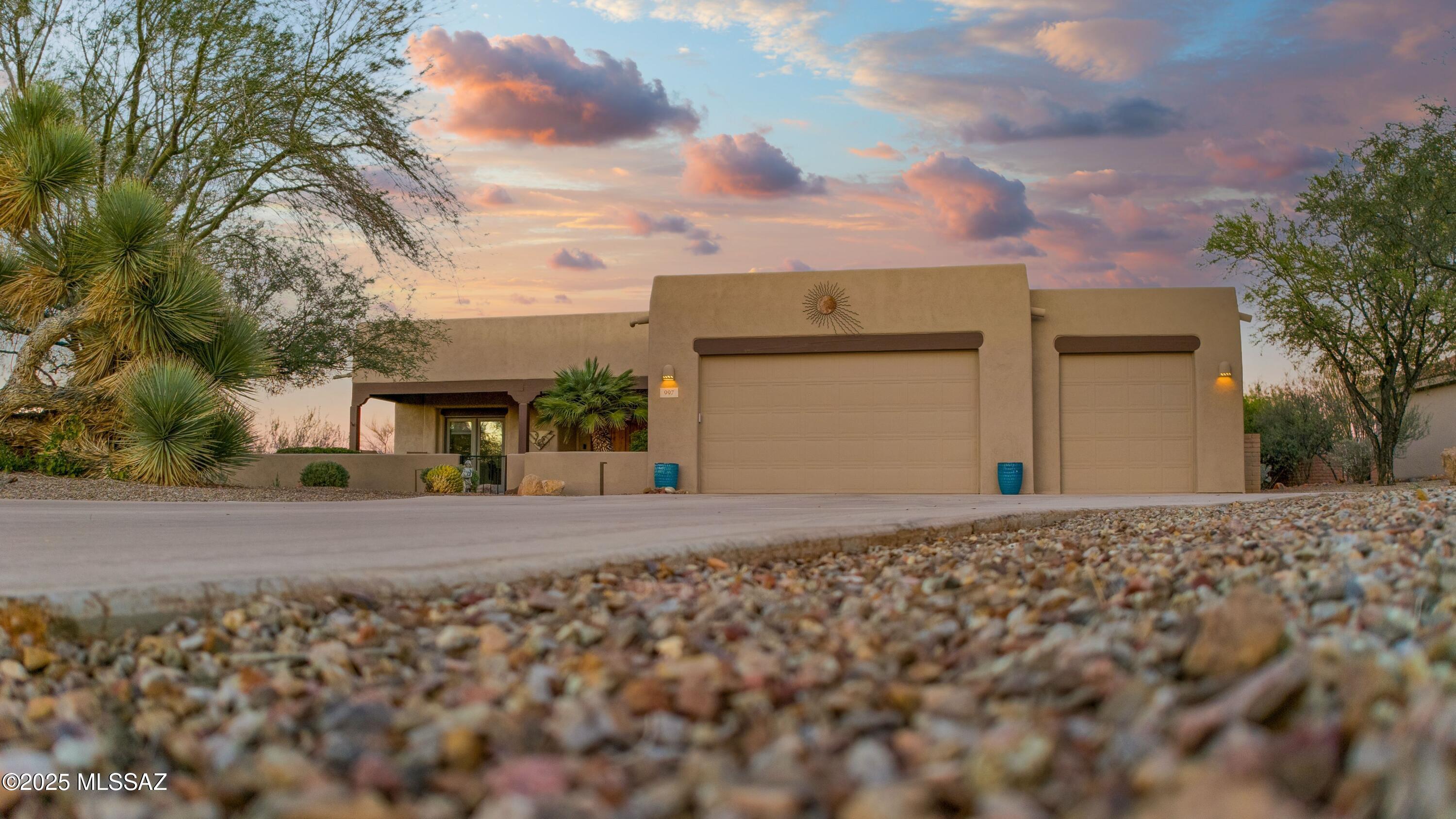 Nestled on a generous quarter-acre lot, this stunning 3-bedroom residence offers an unparalleled connection to the desert's natural splendor. From the moment you arrive, you'll understand that this isn't simply a property—it's a front-row seat to one of nature's most spectacular performances. This property represents more than square footage and amenities—it's an investment in how you want to live. The luxurious finishes ensure lasting beauty and minimal maintenance. The thoughtful design anticipates how you'll actually use the space. The location delivers that increasingly rare combination of natural beauty, privacy, and accessibility. The open desert surroundings create an extraordinary sense of space and freedom that's increasingly rare in today's world. The heart of outdoor entertaining centers around your sparkling pool and spaa shimmering jewel that beckons on warm desert days and cool evenings alike. Imagine diving into crystal-clear waters as the morning sun crests over distant mountains, or unwinding in the spa's therapeutic embrace as stars emerge overhead. This is where family gatherings come alive, where children's laughter echoes across the water, where friends gather for sunset celebrations, and where memories are woven into the fabric of everyday life. The generous quarter-acre lot ensures plenty of space for lounge chairs, outdoor dining areas, and those perfect quiet corners where you can curl up with a book while soaking in the serenity. Step inside, and the magic of the desert landscape doesn't endit intensifies. Floor-to-ceiling windows throughout the home blur the boundaries between interior and exterior, creating a seamless flow that brings the outdoors in. Natural light floods every corner, dancing across luxurious finishes and illuminating thoughtfully designed spaces. These expansive windows aren't just architectural features; they're living artwork, offering views that change with the seasons, the weather, and the time of day.
The open great room serves as the home's centerpiecea generous, flowing space designed for both grand entertaining and intimate family moments. Here, the roaring beehive fireplace commands attention and draws people together. Understanding that today's homes must serve multiple purposes, this residence offers remarkable flexibility. The three bedrooms provide comfortable, private retreats, but the thoughtful floor plan goes further. There's plenty of room for guests, ensuring that visiting family and friends have their own comfortable spaces. Or perhaps these additional rooms become dedicated home officesincreasingly essential in our connected worldwhere you can work with mountain views as your backdrop and the peaceful desert quiet enhancing your focus.
The large formal den stands apart as a truly special feature. Enclosed by elegant French doors, this room offers privacy and purpose. It might serve as your creative studio, where artistic projects spread out without interruption. Perhaps it becomes a library, lined with books and filled with comfortable reading chairs. It could function as a music room, a hobby space, a formal office for important meetings, or even a peaceful meditation room. The French doors allow you to close it off completely for concentration or open it wide to integrate it with the home's flow. Retreat to the primary suite, and you'll discover a true haven designed for rest, rejuvenation, and romance. Views surround you here too, ensuring that the natural beauty you've fallen in love with extends into your most private space. The spa-like bathroom elevates daily routines into luxurious rituals. Split vanities provide personal space and storage, perfect for couples who appreciate both togetherness and individual territory. The oversized walk-in shower offers room to breathe and move, and those finishes that transform a simple shower into a therapeutic experience. Whether you're seeking a permanent residence or a getaway retreat, whether you're entering retirement or embracing a new phase of life, this home positions itself perfectly for transformation and new beginnings. The desert has long called to those seeking clarity, renewal, and authentic living. This property answers that call with grace and sophistication.