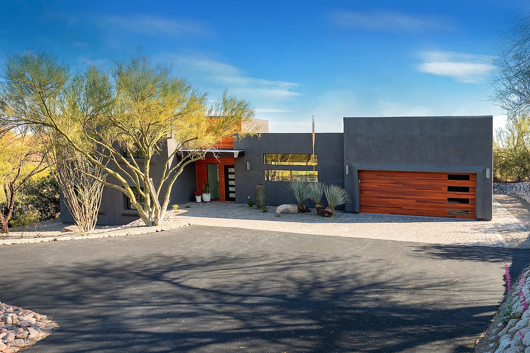 Magnificently Modern in Tucson's Central Foothills. Interior Designer's personal project captures that Contemporary vibe. Stunning inside & out, this VIEW property has been re-imagined & expertly renovated, perfectly blending the amazing natural setting w/ sophisticated design. Perfect pallete of modern colors & textures. Wood plank floors blend w/ textured York Wallpaper, pristine Soho Quartz counters, exposed wood beams, concrete tile, marble and custom paint colors. Oversized Milguard windows and sliders have created amazing natural light throughout the home. Showroom quality kitchen anchors the house. Every room and space have been thoughtfully and creatively finished. Amazing backyard with Built-in BBQ, Large paver patios, sparkling pool and amazing covered view balcony.