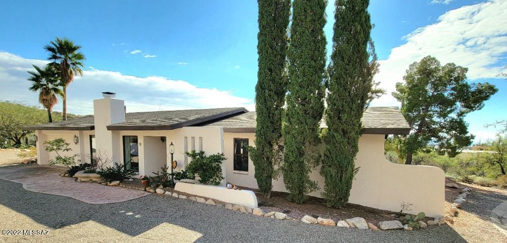 Amazing mountain and city  views!
 Located in the prestigious Skyline Country Club, this beautiful 3 bedrooms, 2 baths home sits on a private 1acre lot. The updated kitchen features stainless steel appliances and opens to the dining/family area. Master bedroom includes a walk-in closet and a private ensuite bathroom with walk-in shower. In addition to the bright and spacious interior living areas, including a formal living room with fireplace, this ranch style home, offers a covered patio that runs the entire length of the house, providing a gorgeous outdoor space perfect for entertaining or simply enjoying the breathtaking Tucson sunsets! 
 Come experience the Skyline Country Club Estates with full time guarded gate entry and access to all of the Country Club amenities including fitness center, tennis courts, golf course & more.