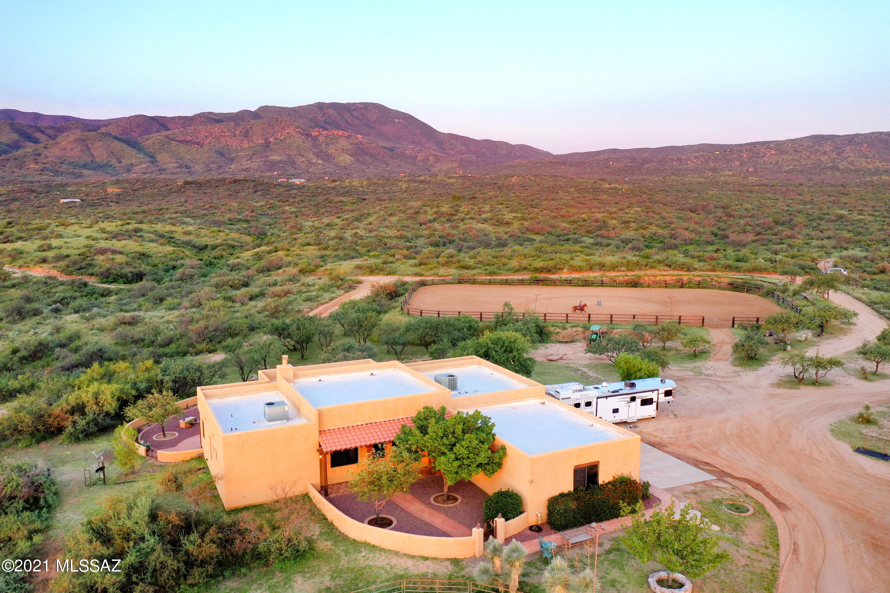 Located in Oracle AZ (not San Manuel) this stunning Horse Property on 4 acres borders Coronado National Forest. Mild year round climate (elevation 4700) allows you to enjoy riding and the outdoors 365 days a year. The custom built home has been immaculately maintained and constantly improved upon. Spacious  split bedroom floor plan with 3 bedroom, 2 bath, great room plus den. Granit countertops with large kitchen island, plus large walk in pantry for all of your kitchen needs. Master bedroom has large master bath with huge walk in shower, soaker tub, and 2 spacious walk in closet. 3 Car garage, plus additional storage in horse facilities. Back covered patio is great for entertaining with firepit, BBQ, and views of the Catalina Mountains.  Horse stalls and corrals plus lighted roping arena