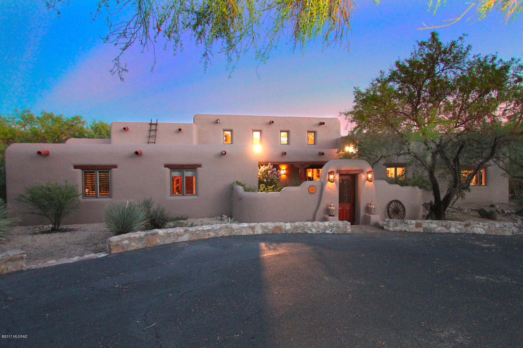 Spectacular custom mud adobe hacienda, built by master craftsman Mark Butler. Situated on 2 lots, 12 ac-horse property incl. a portion of Agua Caliente Creek! Sell 1 lot or build on 2nd. Stunning mountain views & endless riding trails! Lush mesquites & saguaros surround secluded, 4 BR + updated 1 BR GH, estate w/hand fabricated beams, latillas & doors/windows! New mstr bth  w/freestanding tub. Enjoy $12-$60 electric bills w/$62,000 hidden solar panels. Lighted arena, endless riding trails & stables, corrals, w/tack, workshop, storage rms, wash rack, stalls, paddocks & hay barn. Lg metal building-RV/toys! Stunning home w/great rm open to inviting kit. w/concrete counters.  Magnificent pebble tec pool/spa w/outdr FP & 2 ramadas overlooking  A true retreat for those who cherish SW luxury!