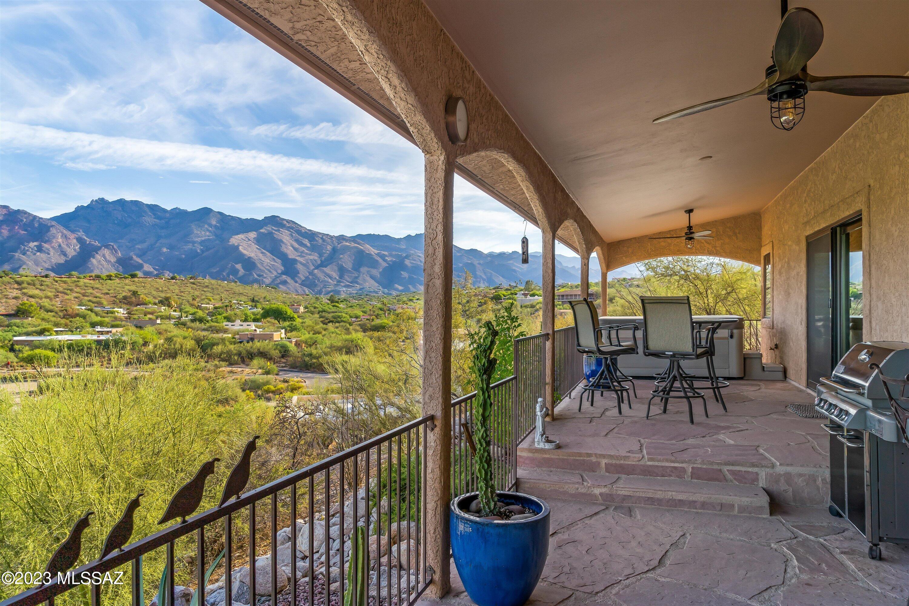 Atop a spectacular hill in the heart of the Foothills sits this magnificent and lovingly cared for home with unobstructed views of the Santa Catalina Mountains. Thoughtful updates shine throughout, including the kitchen, baths and flooring. Relax on the private extended patio and enjoy this intimate setting while relaxing in the hot tub. Whether it is sunrise or sunset, you will marvel at the expansive mountain views and twinkling lights. Other features include a passthrough fireplace, an extended garage with high ceilings and an epoxy floor, whole-house water purifying system, reverse osmosis drinking water, gas stub for grilling on patio, tankless water heater, wet bar with wine fridge, double walk-in closets in primary bedroom with a slider to the patio and gas fireplace. Floorplan and virtual tour available upon request.