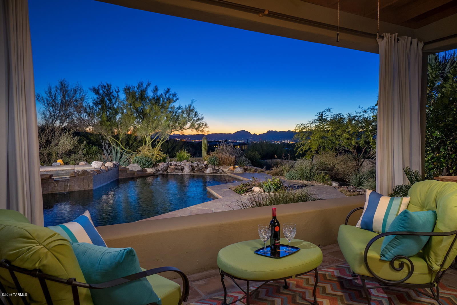 This elegant, quintessential Tyson-Murphy built home is tucked away in a small, private enclave in the heart of the Catalina Foothills. This mid-century modern style home boasts of stunning city or mountain views from every window. Recent high-end upgrades include tastefully remodeled kitchen and baths and Pella windows throughout. Guest quarters include a full bath, private patio and outside entrance. The landscaped grounds would make the Botanical Gardens proud.