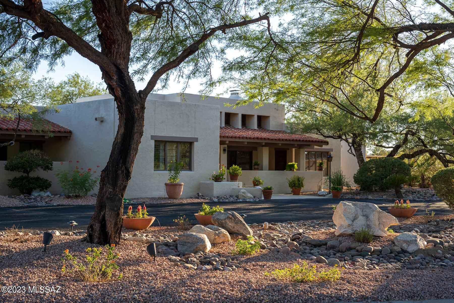 Welcome to this fabulous, elegant, newly updated Tucson Country Club home. In collaboration with Lori Carroll & Associates, the owner has installed beautiful new 2023 hardwood flooring throughout and fully updated the kitchen and all 3 baths. There are magnificent high ceilings in the major living areas, which are open and ideal for entertaining. The primary bedroom, bath, and den are spectacular, and the closet is to die for. Custom alder cabinets & quartz countertops are throughout. 2 state of the art gas fireplaces. Handsome Cafe Series gas range & refrigerator. Pantry. Split bedroom plan. This fine home is move-in ready. The manned gate operates 24/7, & provides excellent security & communication with the homeowners. Belonging to the Club is optional, but for members, there are many fine features. The beautiful clubhouse is a 44,000 square foot facility. The Club features a championship tree-lined 18-hole golf course designed by William Bell. It now is the new home of the University of Arizona golf teams. There are 9 Championship hard tennis courts, 1 Classic Red Clay (artificial) court, and 4 Pickleball courts. The outstanding Fitness Center has up to date equipment and flexible hours. There are lovely heated lap and recreational pools with a slide and splash pad, and great mountain views. 
Home warranty in place until August 14, 2024.
