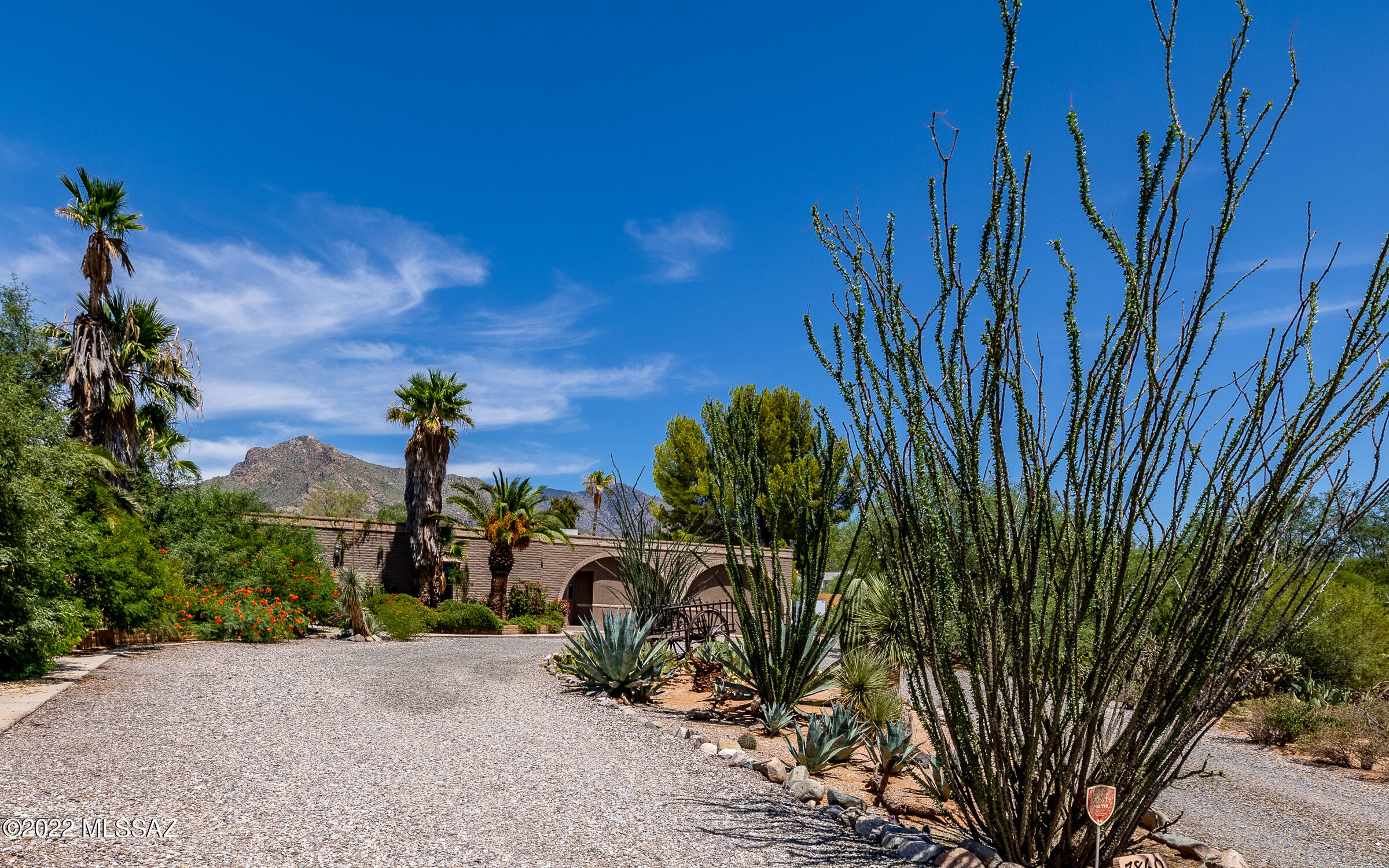 Impeccably maintained family compound on 1.12 acres. Low square foot price for NW area. Save the rent on your business and keep every thing at home! No HOA-CR1 zoning. 3 separate living spaces for home business w vehicle storage, income potential, multi-generational lifestyle. Multiple fenced yards, for large dog run, RV's & toys, commercial storage. Over 1300 sqft of workshops, sheds plus a Ground set cargo container w shaded work area.  Approx 1000 sq ft dance studio/open space w office. Roof recoated, Air conditioner/ furnace replaced, main water heater replaced, Exterior freshly painted, Swimming pool pump and filter replaced in 2021. Front and rear septic tanks pumped and certified 2022. Priceless, mature trees, bedded perennials, shrubs. Attached Casita w 1bed/1bath, full kitchen, dining and living room, separate entrance. Studio w 1bath, kitchenette. Main house has deep covered east facing back porch surrounding a sparkling pool w BBQ and various seating and dining areas. Inviting, warm flow thruout this home. Eat in kitchen w cozy fireplace, island and breakfast bar. Split bedroom plan in main house. Entertainers delight!  Large laundry room and craft room w built in shelving off kitchen. Den/media room w sunken bar.
(
Excellent business location near Ina and Oracle-easy access to other areas of Tucson. Convenient to shopping, hospitals, hiking/outdoor activities, biking, golf, restaurants, I10. Walking distance to schools. Seclusion and privacy in NW.  See this home today to explore and expand your business and family opportunities!