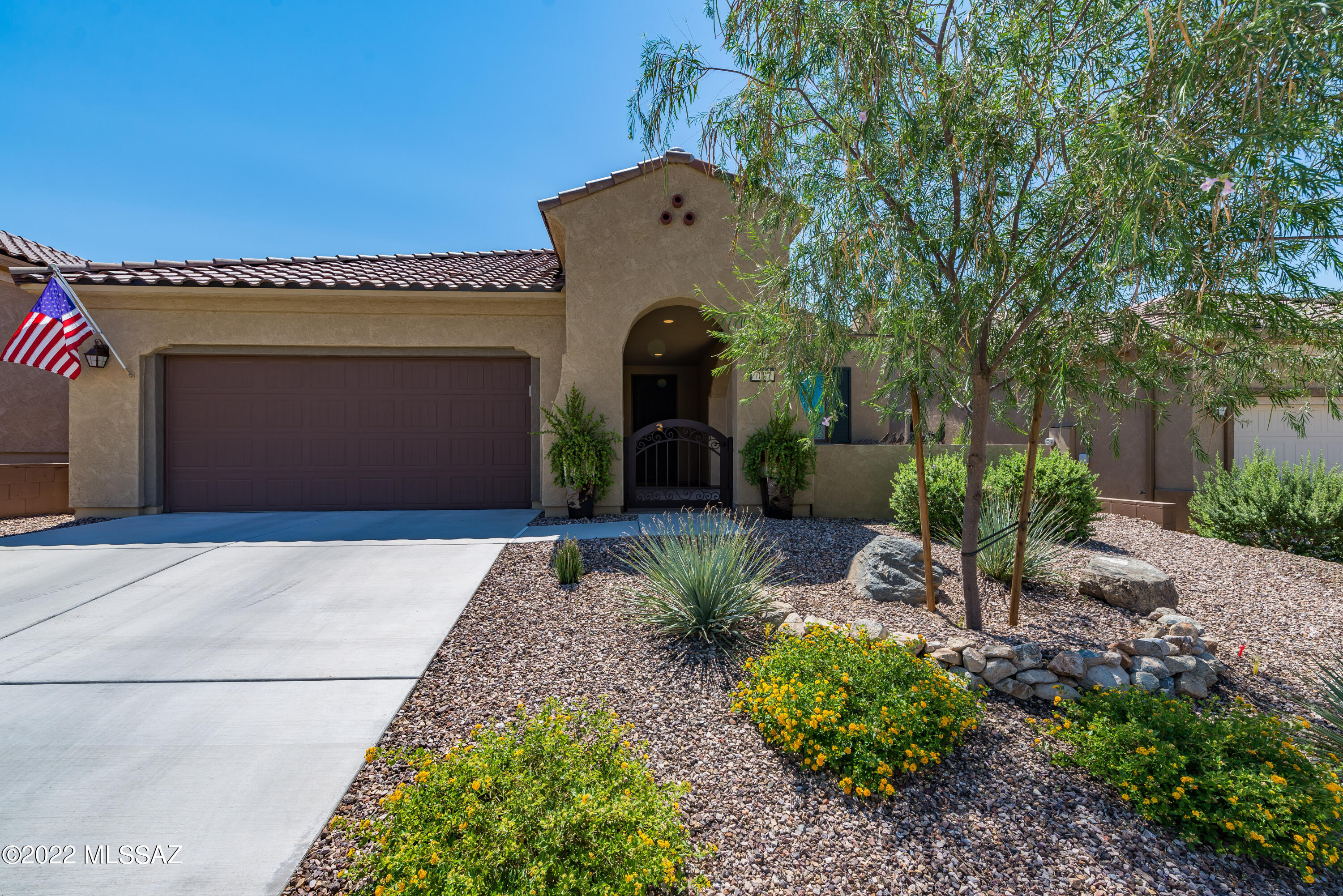 Very highly upgraded and beautiful extended Sanctuary model.  Home has a 4ft extended garage, bay window and extension at rear of home - plus spacious gated front courtyard. Sellers have done abundant upgrades & additions to this home post purchase that range from installing granite countertops in both bathrooms, kitchen upgrades, additional bathroom upgrades, custom cabinetry in garage & laundry room, added lighting & fans and a full landscape creation  - front & rear.  You may read the extended highlight/upgrade list in MLS Documents.  Home shows like a model. All kitchen & laundry room appliances convey w/accepted offer.  Oversized yard, extended garage, extra interior space, immaculate condition. Call for Private Showing.