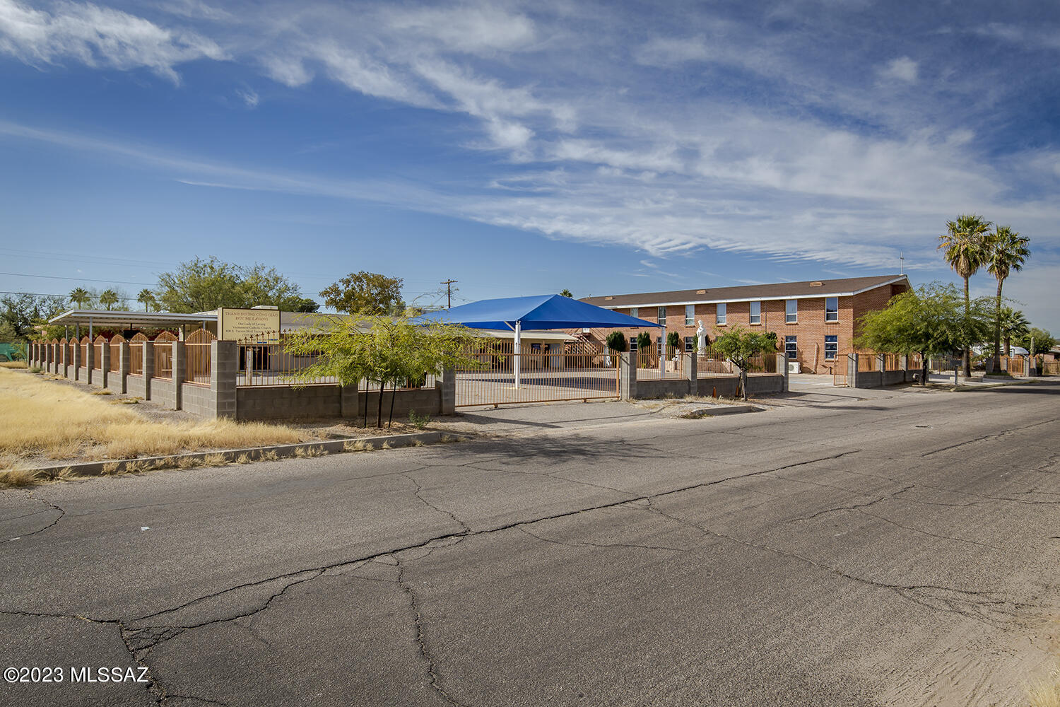 12000 SF Religious facility located in central Tucson . Building 1 - 10,000 SF Total Square Footage - 3000+ Square Foot Chapel, and separate 300 SF 'Quiet Room' Upstairs Five (5) Classrooms/Meeting Rooms, (4) Offices and Kitchen Area. Building 2 - Total square footage 2900 which includes a 1300 SF Parish Hall, Office, Meeting/Conference Room & fully equipped Commercial Kitchen.

Zoning R-2. Four (4) separate contiguous parcels totaling .707 Acres/30,797 SF. Ample on-site parking. All furnishings (EXCEPT: folding chairs, walk-in refrigerator, statue of Our Lady and two (2) angel statues) shall convey. If the Buyer's use is not for religious purposes, the Owner shall remove the altar and the pews. Property is being sold 'AS IS'.