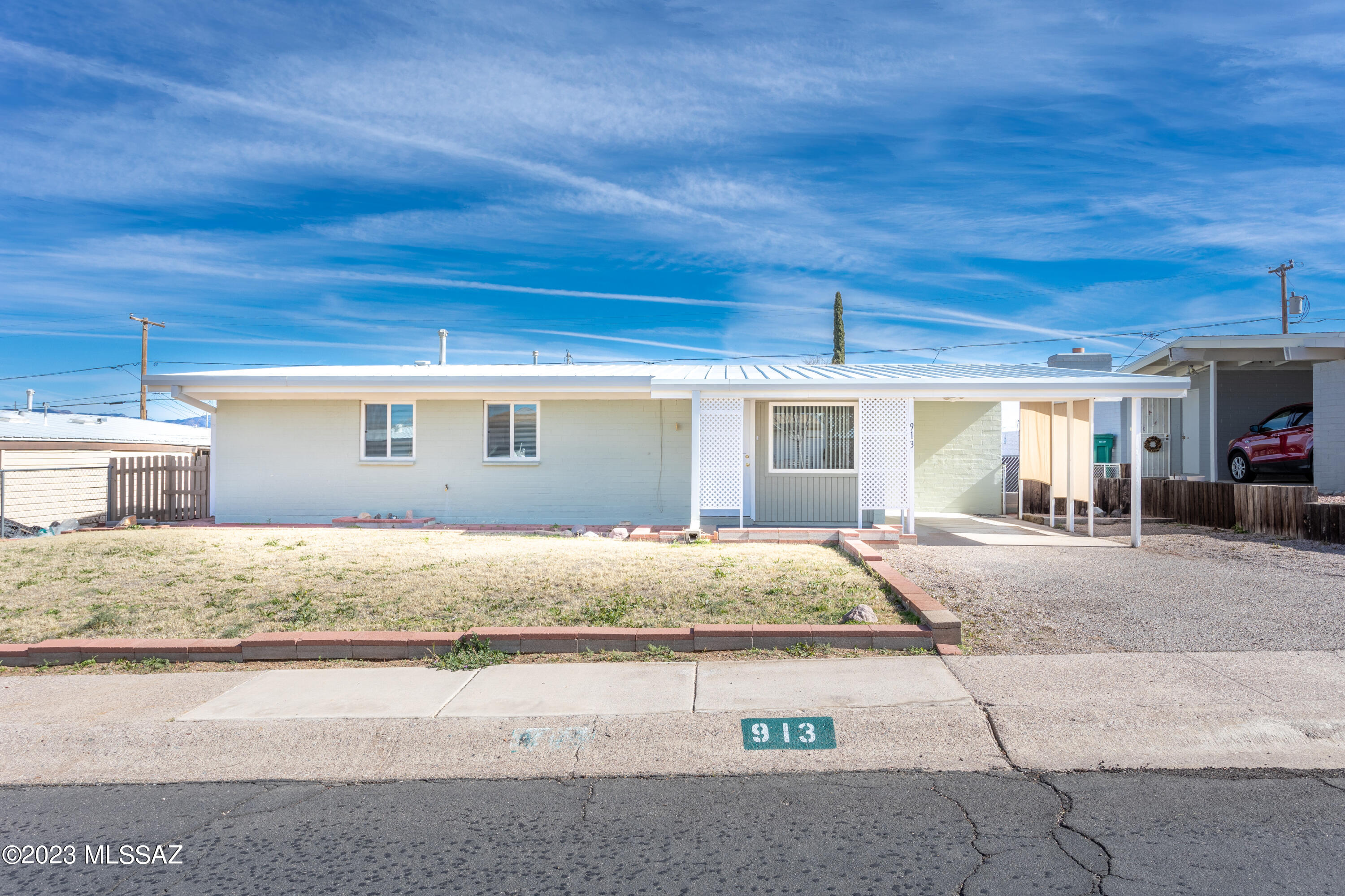 This sweet home has great value with a metal roof, dual pane windows, and central AC! Clean and freshly painted, with new carpeting through out. The spacious backyard offers beautiful views of the mountains along with a storage shed and a brick patio seating area. The laundry hook ups are enclosed in the Arizona room on the back of the home, which also gives access to an additional storage area. In the kitchen you'll find lots of storage and an eat in feature, while a pedestal sink in the bathroom adds a bit of glamour to this functional space. Come and see what this home has to offer!