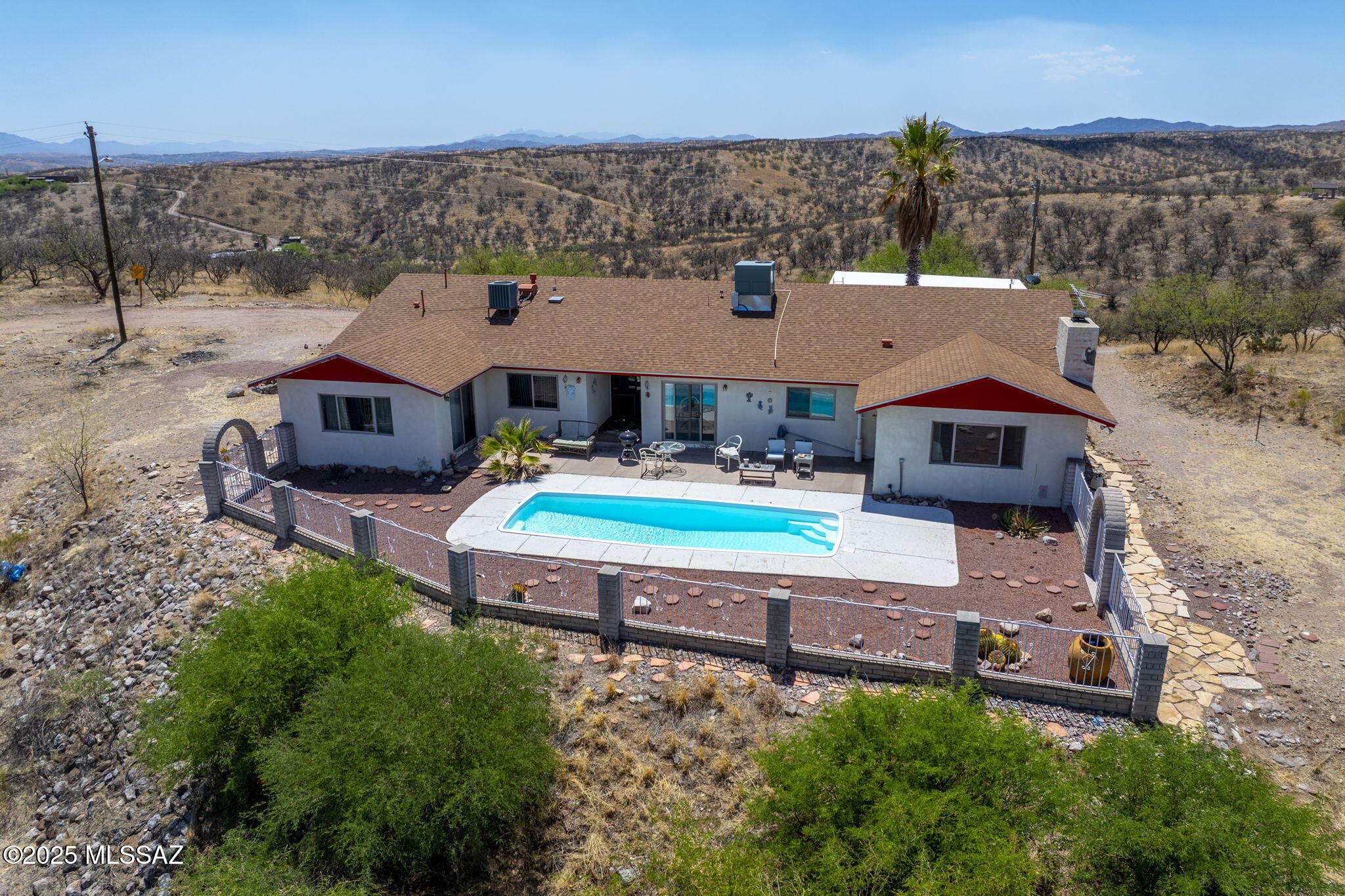 Range priced from $300,000 to $350,000, this stunning 4-bedroom, 2.5-bathroom hilltop home in Rio Rico, Arizona offers breathtaking panoramic views, a sparkling pool, and a spacious, open layout ideal for comfortable living and entertaining. The interior features granite countertops, a bright kitchen, and a 2-year-old roof, while the beautifully landscaped yard includes a brand-new retaining wall for added stability and curb appeal. Enjoy the privacy of a generously sized lot, a serene desert backdrop, and modern updates throughout—this home is the perfect blend of tranquility, style, and functionality.