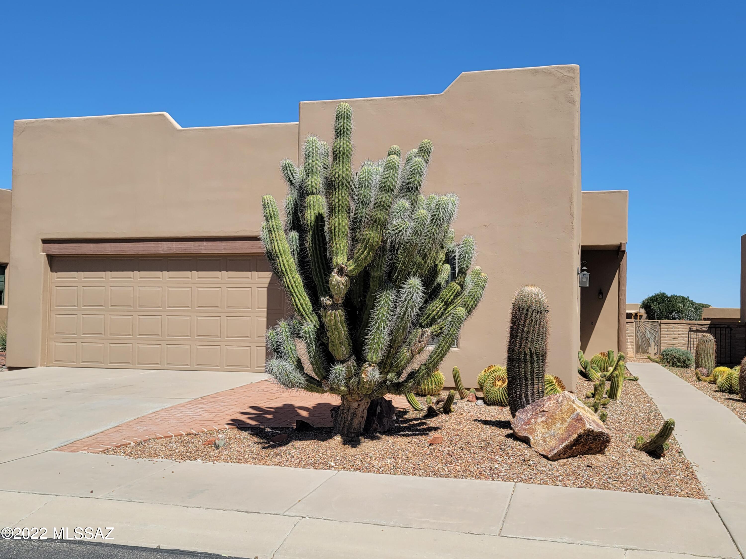 This stand alone home has an entrance located on the side of the home.  The two car garage has storage cabinets and an overhead rack. This home has two bedrooms & two bathrooms.  There is also an extra room that can be used as a third bedroom or an office.  The backyard has a brick patio for your outdoor table & chairs.  Lots of yard to decorate with cactus or  your favorite plants or herbs.  Great view from the back & front patios.  
This home has no upgrades and hoping to find a buyer who would like to make this home their own.