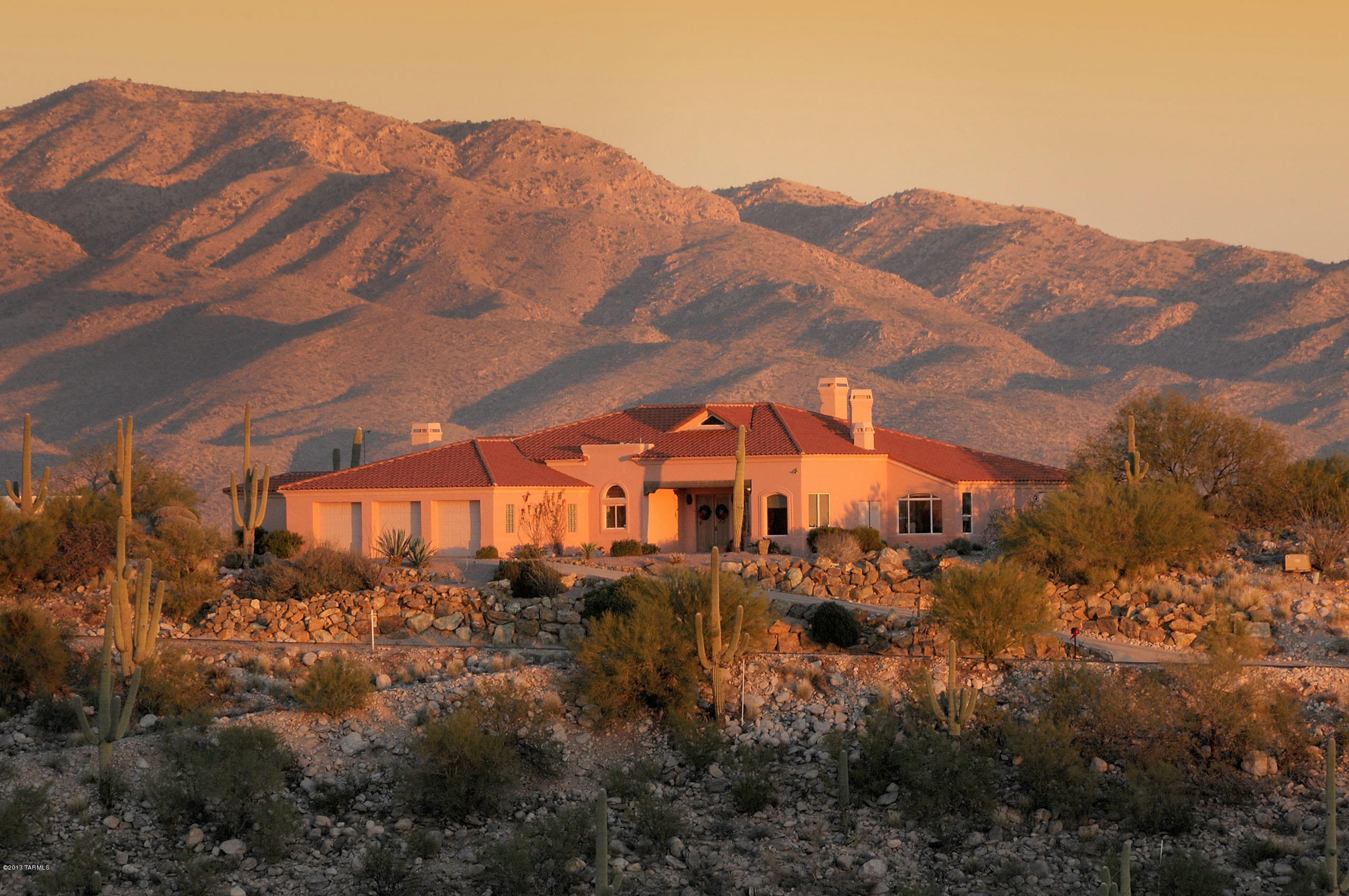 High on a hill in the Catalina Fthls w/unprecedented 360 degree city & mtn views. Cul-de-sac lot designed by Ron Robinette, interiors by Lori Carroll. 4 bdrm or 3 dbrms + den. LR w/dramatic 20' ceilings & outstanding architectural design, travertine flrs, gourmet kitchen w/granite counters & views. Views from all rms, 3 FP's, gracious mstr ste w/fireplace flrs. 3 car garage w/workshop & extra high garage doors. Stunning rear yard w/''see forever views'', pool/spa BBQ w/refridgerator & wrap around porch. See all fireworks in town on the Fourth of July.
