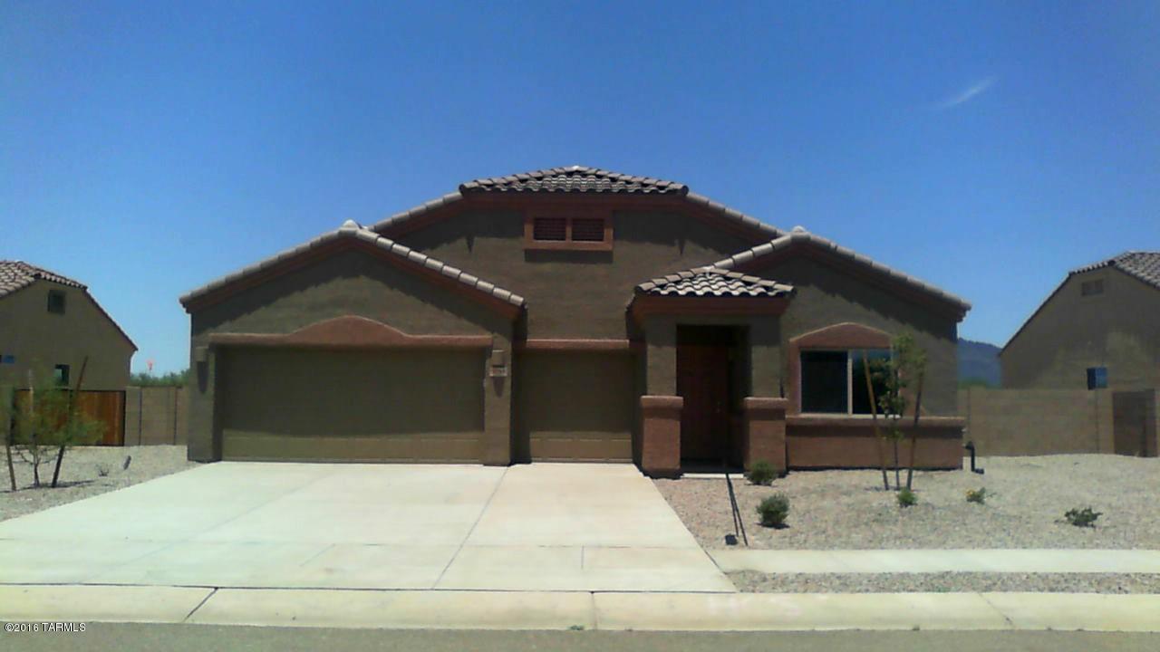This home boasts a MASSIVE covered patio opening to the natural desert to the North.  Huge kitchen with espresso cabinets and stainless steel appliances including a gas range.  Vaulted ceilings, 18 x 18 tile flooring and upgraded carpet set this home apart.   This Energy Star Qualified Home will save you up to 30% on your utility bills every month! Quality construction and low cost of ownership with a builder warranty - A MUST SEE!  This will be completed soon and ready for move in by the end of June.  Come see your dream home today