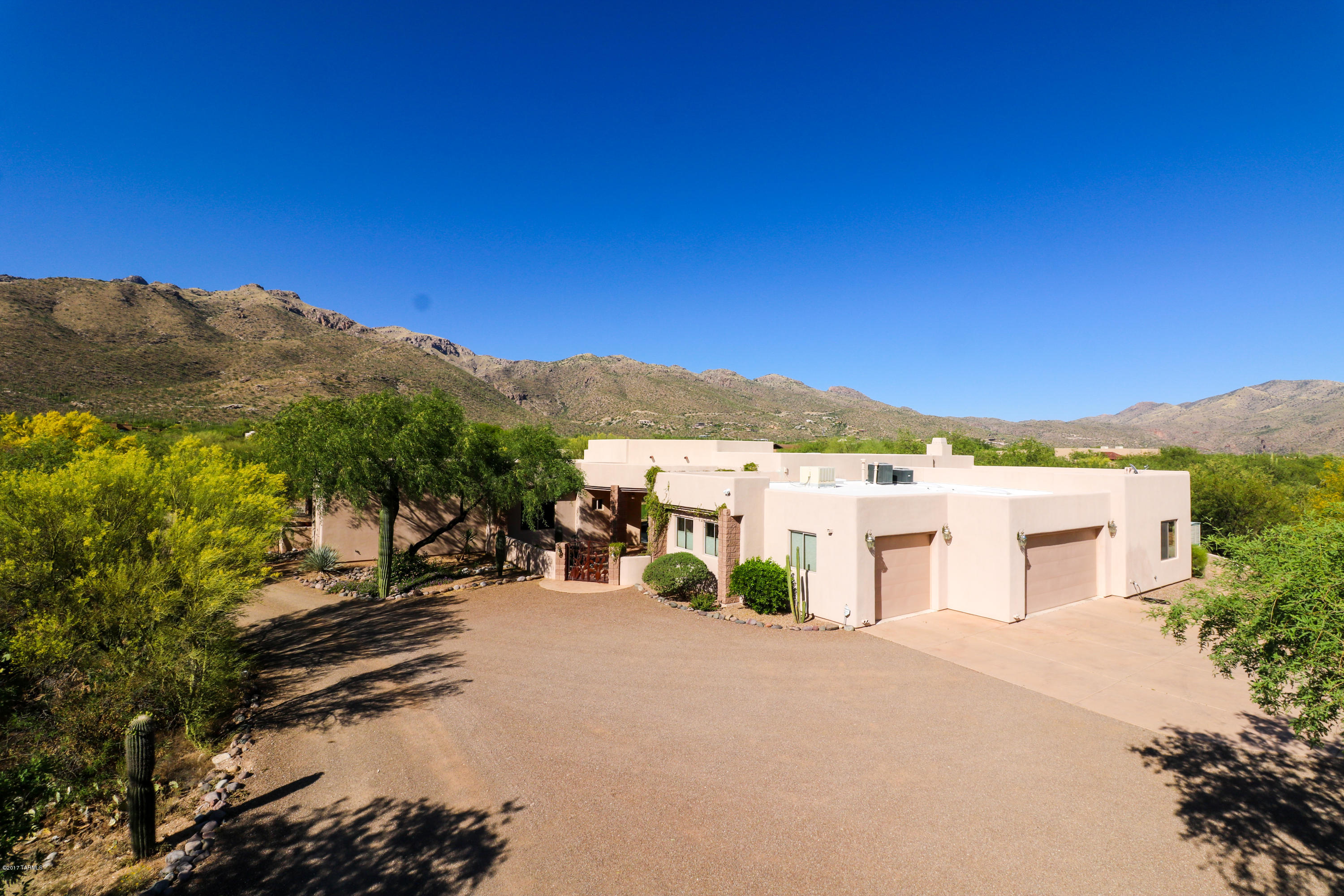 Seller will consider offers between $800,000 and $825,000. Impressive Mountain Views on 3.31 Acres in Secluded Gated Neighborhood! Resort Style Backyard w/over 2,000sf of Covered Patio, Custom Pool & Spa, Built-In BBQ, Gas Firepit, Synthetic Grass & In-Ground Trampoline! Gourmet Kitchen has Granite Counters w/Glass Tile Backsplash, Oversize Custom Alder Cabinets, Island with Breakfast Bar, Stainless Appliances Include Sub Zero Refrigerator & Dacor Range! Amazing Stacked Stone Fireplace & Bar w/Cabinets in Living Room. Coffered Ceiling in Formal Dining Room. Large Master Suite w/Dual Vanities, Jetted Tub, & Walk-In Shower. Walk-In Closets in Every Bedroom, Natural Stone Floors & 8ft Alder Doors! Newer 16 Seer AC. Huge 3 Car Garage w/Surround Sound. RV Storage w/Hookups.