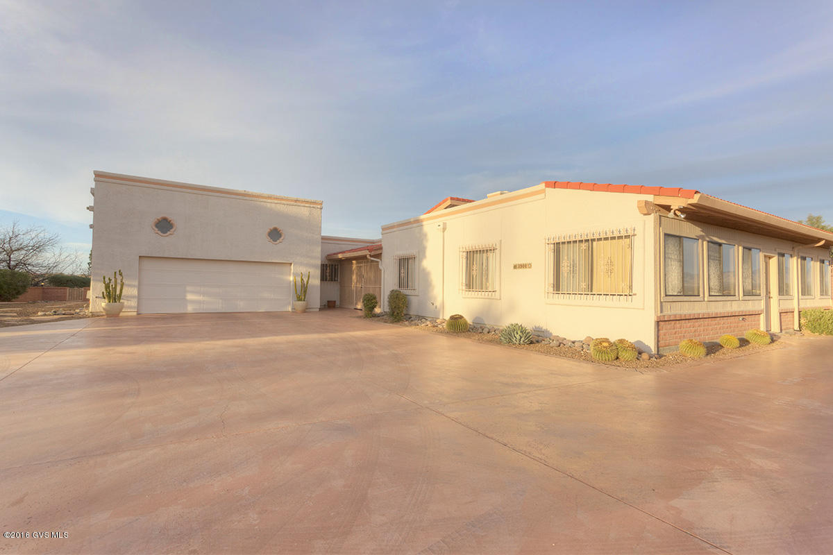 Enjoy spectacular, panoramic views from nearly every window in this custom home in Canoa Canyon Estates that features over 1,400 sq.ft. of wrap-around enclosed patios. Spotless home w/all tile floors, updated kitchen with granite composite counter tops, abundant storage, and breakfast area. Large family room off kitchen has built-in storage and wine racks. Oversized LR has fireplace and dry bar; Formal DR. Oversized bedrooms and Office/Den. Both full baths have been remodeled with exec height vanities. Private courtyards off both bedrooms. Attic storage can accessed from the garage. Private 1.13 acre lot. A must see!