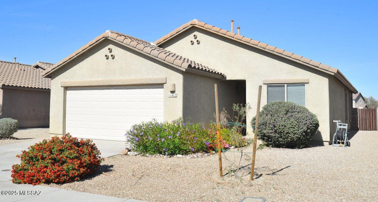 Charming and adorable home in San Lucas on large lot. 3BR/2BA home with wood and tile flooring throughout (no carpet). Nicely upgraded kitchen with stainless appliances and tile back splash. Beautiful two tone paint throughout. Washer/dryer included! Tile roof, 2 car garage. There's not much for rent this clean and charming in this price range in Marana/NW areas so this needs to go on the ''must see'' list because it won't last long! Multiple parks and play areas throughout the community. Just off I-10 at the Marana exit. Minimum 1 year lease required - longer term lease possible.  Non-smoking home. $45 application fee per adult. Subject to credit approval. Renters insurance required. Call listing agent for additional lease details and pet policy.