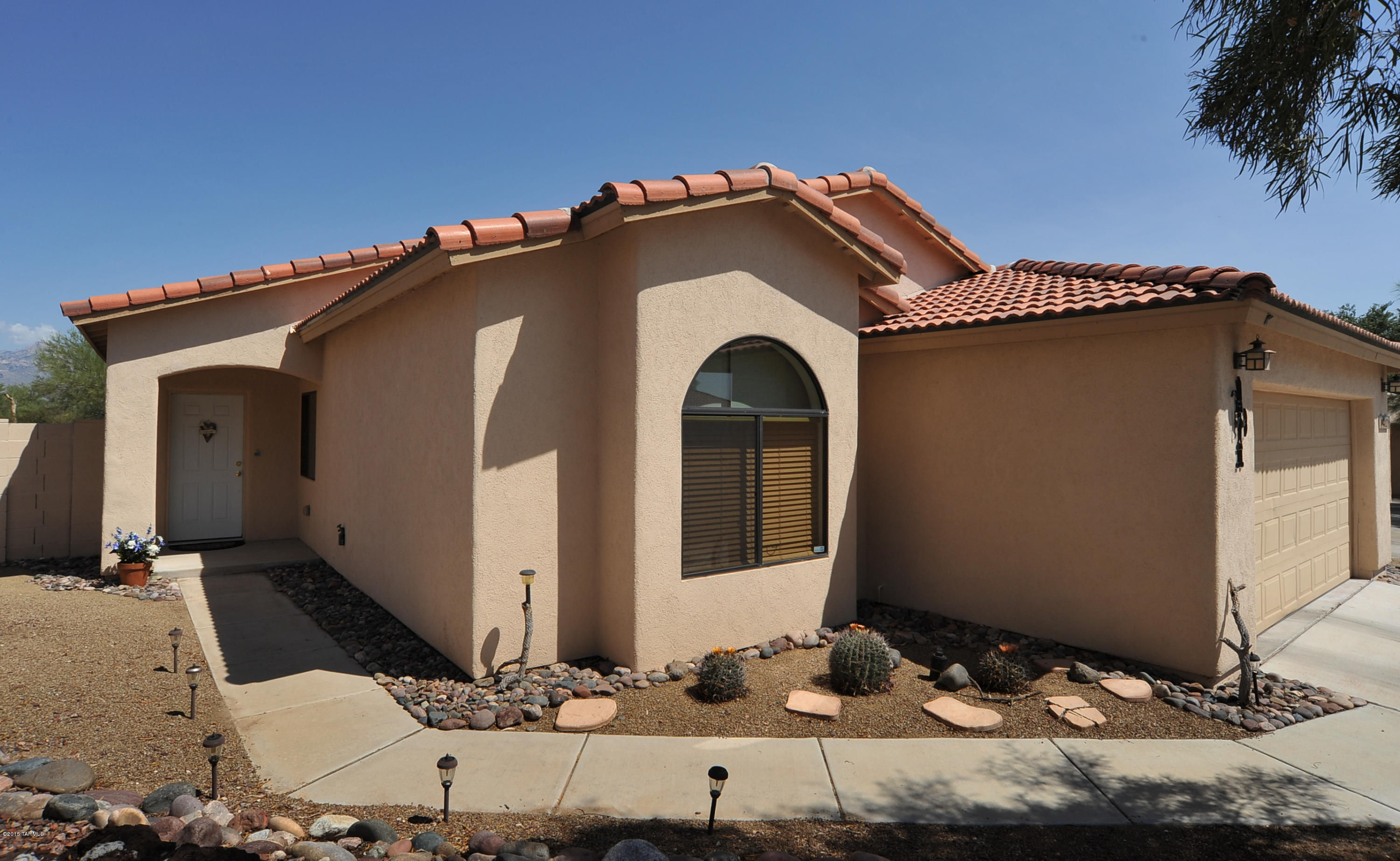 Unobstructed Catalina Mountain Views from this Beautiful Home with the Newest Construction in a Mature, Gated Northwest Community. This 4 Bed, 2 Full Bath Home with 1631 Sqft Sits on a Quiet Cul-De-Sac Featuring Open Floor Plan, 9 ft Ceilings, Recessed Lighting & Tile Flooring Throughout. Large Master Bedroom has Double Sink Vanity & Tiled Shower with Garden Tub. Large Backyard, Covered Patio & Common Area with Hiking & Biking Trails behind Property. This Home is a Must See!
