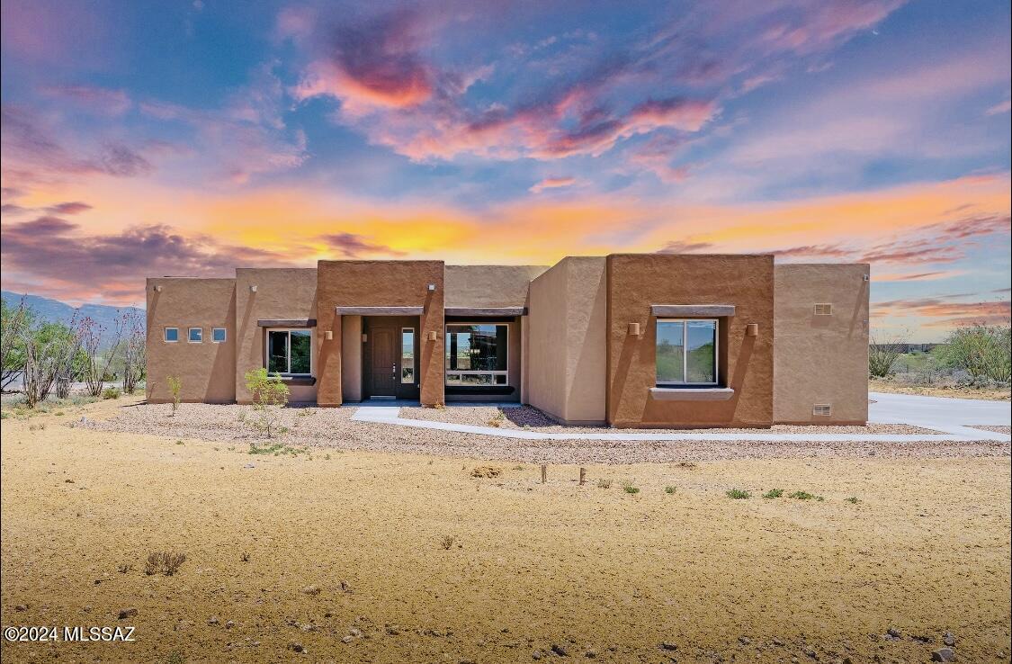 New construction home. Welcome to the vibrant and luxurious home in the highly sought-after Windmill Ridge community located in Vail, AZ! This stunning home, built by Dell Mar Homes, promises a quick move-in opportunity. Spanning an expansive lot with breathtaking views, this Rincon model boasts an impressive 2,873 square feet of living space featuring 4 bedrooms and 3 full baths with a flex room. The rotation of the home was selected to ensure the views and privacy are maximized. Step inside and be captivated by the open-concept floor plan, designed to maximize natural light and provide a seamless flow throughout. The great room is adorned with large, awe-inspiring windows that invite the beauty of the outdoors in. Prepare to be wowed by the gourmet kitche a haven for culinary enthusiasts; with its spacious layout and double stack alder cabinets to the ceiling in a timeless spice satin stain, this kitchen exudes timeless elegance. The large granite counter island adds a touch of sophistication and provides ample space for meal preparation and entertaining guests.

The 3-car garage, with modern garage doors that add a touch of charm to the exterior with a 4-foot extension and 10ft ceiling, giving plenty of storage space.

Escape to the primary suite, a spacious retreat that offers tranquility and relaxation. The large shower is adorned with contemporary tile that extends all the way to the ceiling. Unwind in the soothing tub or revel in the generous closet space, adding a touch of luxury to your everyday routine.

Step outside onto the expansive patio that stretches from one side of the house to the other. With a high ceiling reaching 10 feet and doors standing tall at 8 feet, this home exudes a grand and open atmosphere. Don't miss the chance to make this dream home yours. Schedule a showing today and experience this home's elevated and timeless beauty