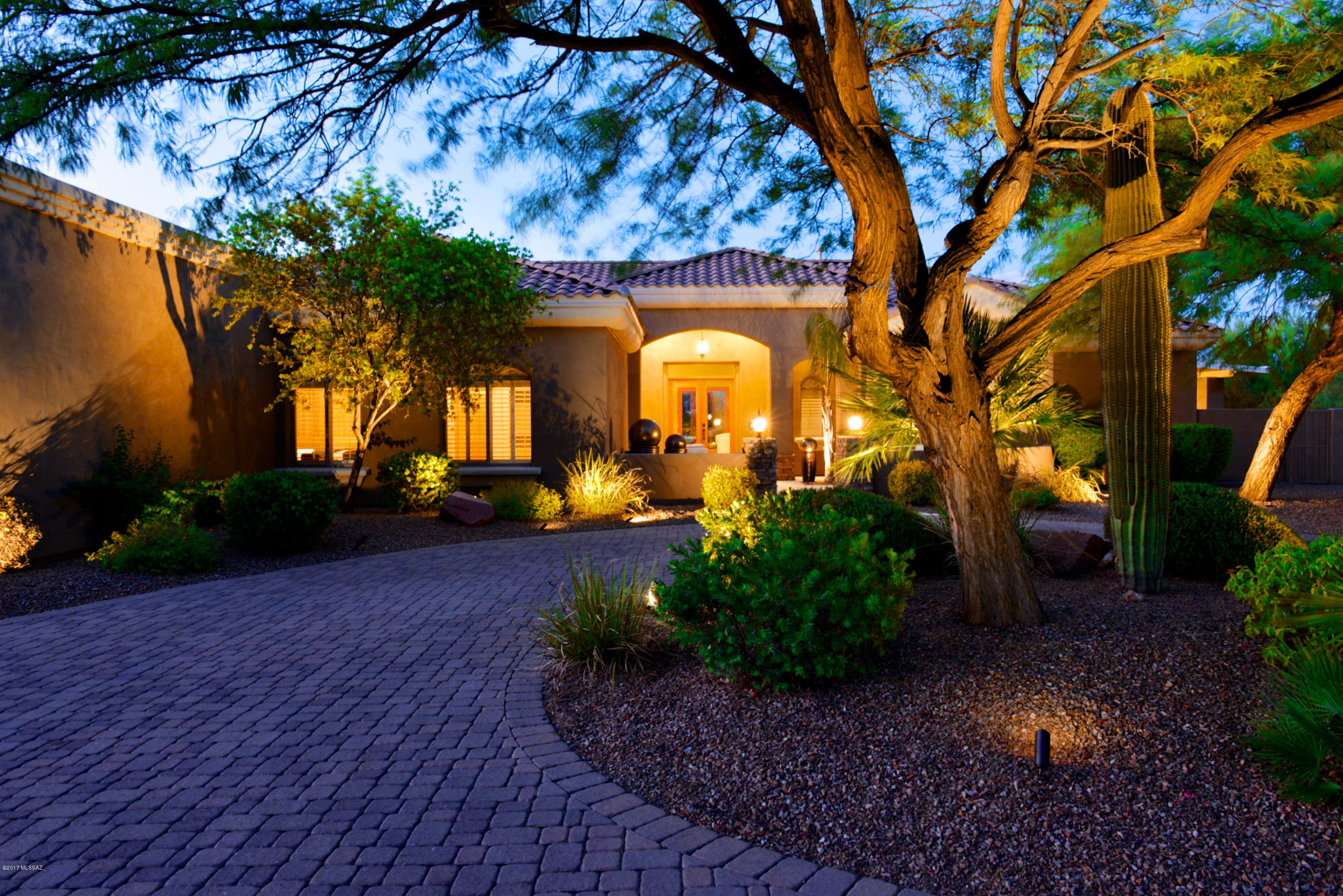 Ready to fall in love? This magnificently stunning, serene property, will capture your heart. Situated on 3+ acres of horse zoned space, expansive mountain views abound & are equally enjoyable from the interior or exquisite pool, spa, patio or putting green. A glass of wine only complements the sunsets you will take in, while exterior fireplaces will warm your soul on a chilly evening with friends. Once your guests have gone, retreat to your private master sanctuary with coffered ceiling, fireplace & sitting area that will envelop you and your sweetie. Of course, as would be expected from this caliber of home, well appointed finishes are found throughout along with a thoughtful layout that includes a welcoming courtyard, elegant Den, 3 car extended garage and impeccably landscaped grounds!
