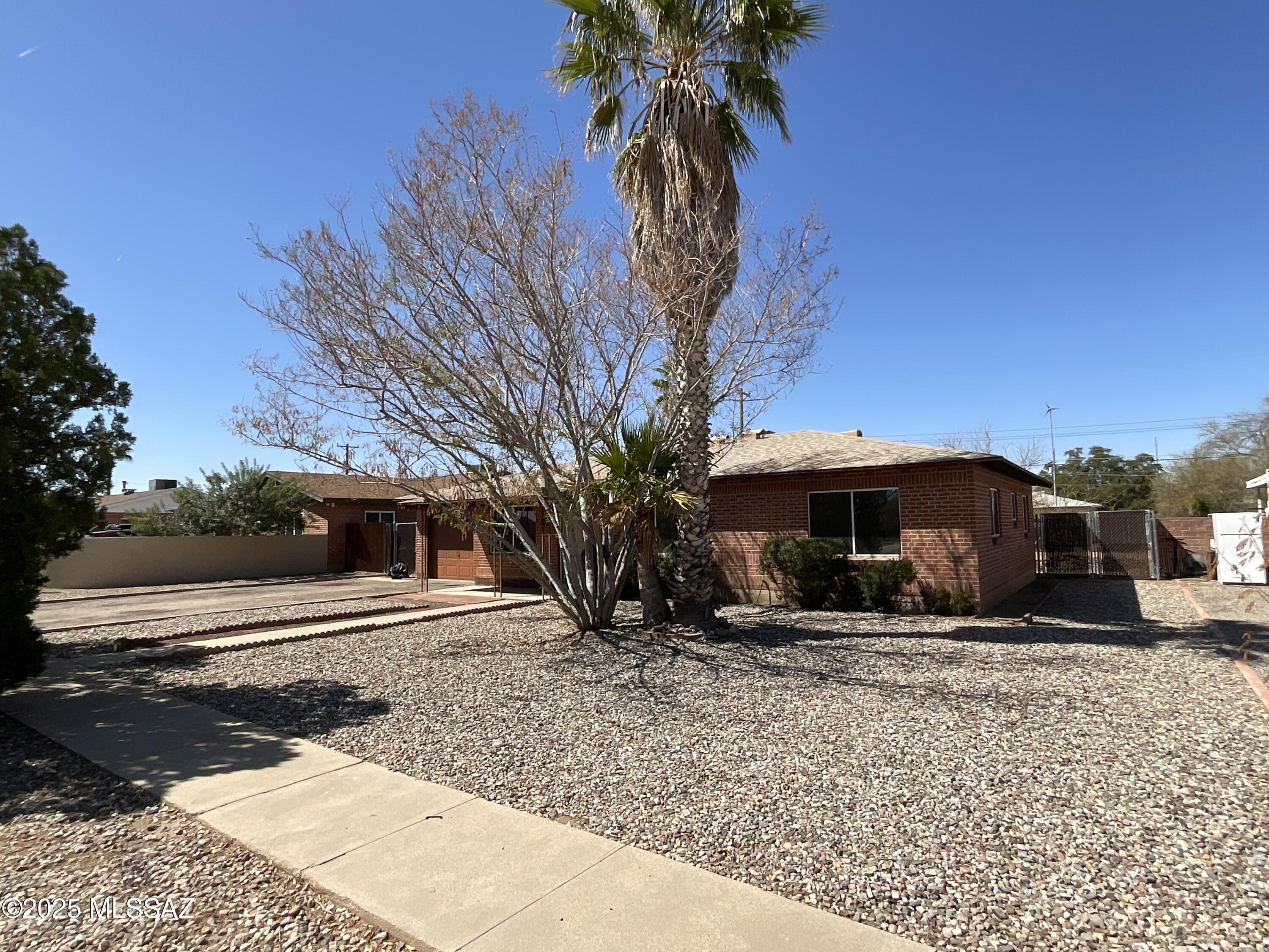 Wire brick three bedroom two bath home with single car garage. This is a fixer with great bones. November of 2012 new roof, March of 2021 all pex plumbing installed and January of 2023 new HVAC. Sale is ''AS IS'', ten day inspection, cash or conventional financing only. Large fenced rear yard and covered patio. Dual pane windows.  Large 20.9 acre lot.