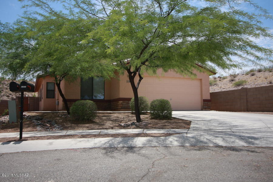 DO NOT DISTURB OCCUPANTS! 
 PLANK TILES IN ALL TRAFFIC AND LIVING AREAS, CARPET IN BEDROOMS.  INTERIOR IS FRESHLY PAINTED.  Very private home tucked in corner of cul-de-sac only one neighbor. Kitchen features STAINLESS APPLIANCES, and lots of cabinet space and countertop area, electric cooktop, and double sinks. Kitchen is open. Living Room plus den.   All bedrooms have ceiling fans. Bathrooms are tiled  WITH shower enclosures. Garage is finished with epoxy floor covering. Very large back yard. Washer and Dryer are included. Please call regarding pet requests.