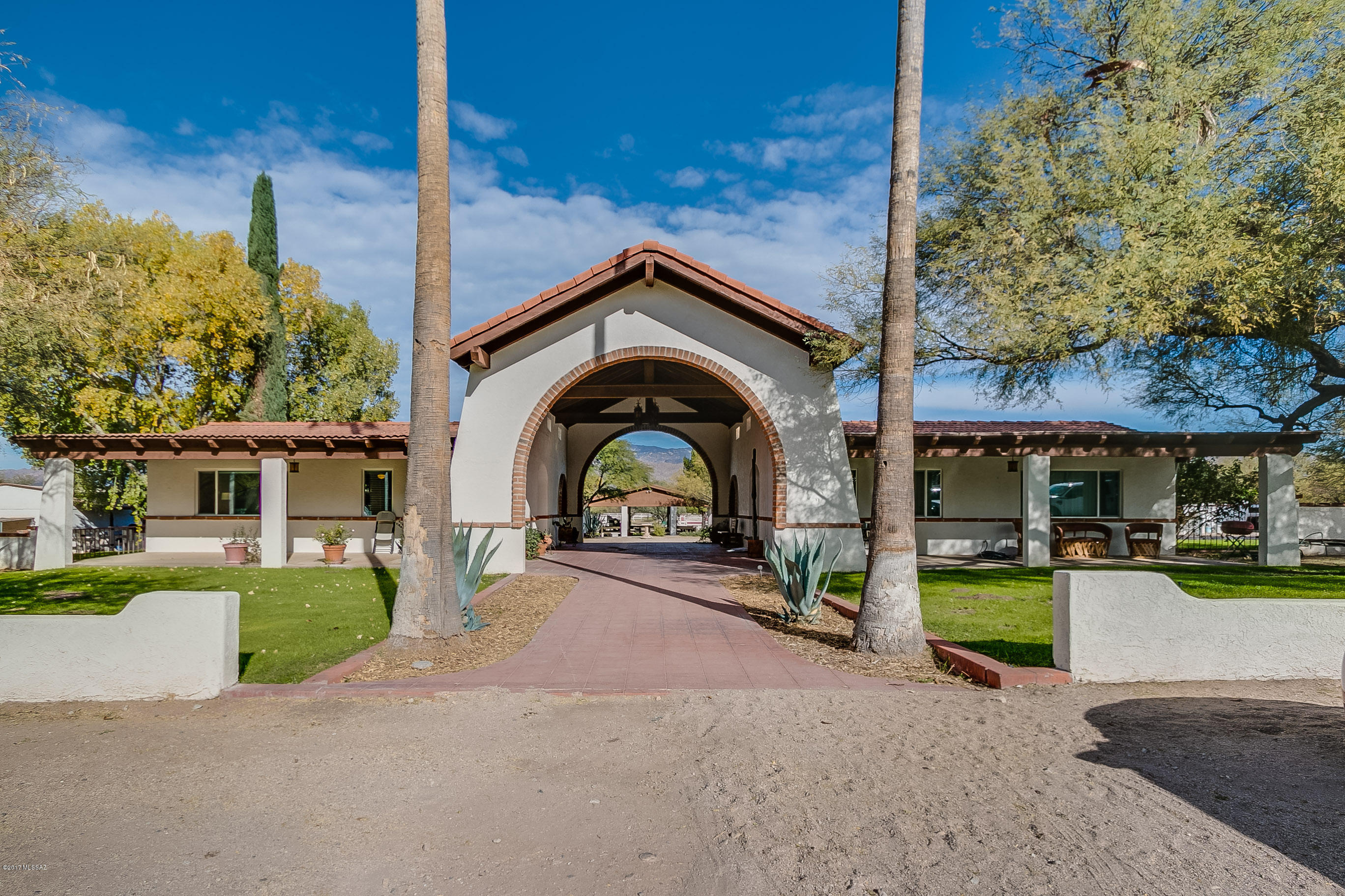 TUCSON'S PREMIER HORSE BOARDING STABLE, WHEN ONLY THE FINEST WILL DO.  LOCATED ON THE PRIME TANQUE VERDE WASH IN SERENE SETTING WITH GRASS PASTURES AND MATURE TREES. FOUR IRRIGATED PASTURES, SIX DRY PADDOCKS FOR TURN OUTS, TWENTY THREE STALLS (16 WITH RUNS), EXERCISE TRACK, TWO COMPETITION SIZED ARENAS, 10 STALL MARE MOTEL, WASH RACKS HOT AND COLD, GROOMING RAMADA AND HAY BARN! TWO HOUSES AND GATE HOUSE WITH OFFICE AND APARTMENT.  HAS BEEN OPERATING AS A HUNTER/JUMPER FACILITY SINCE 2002.