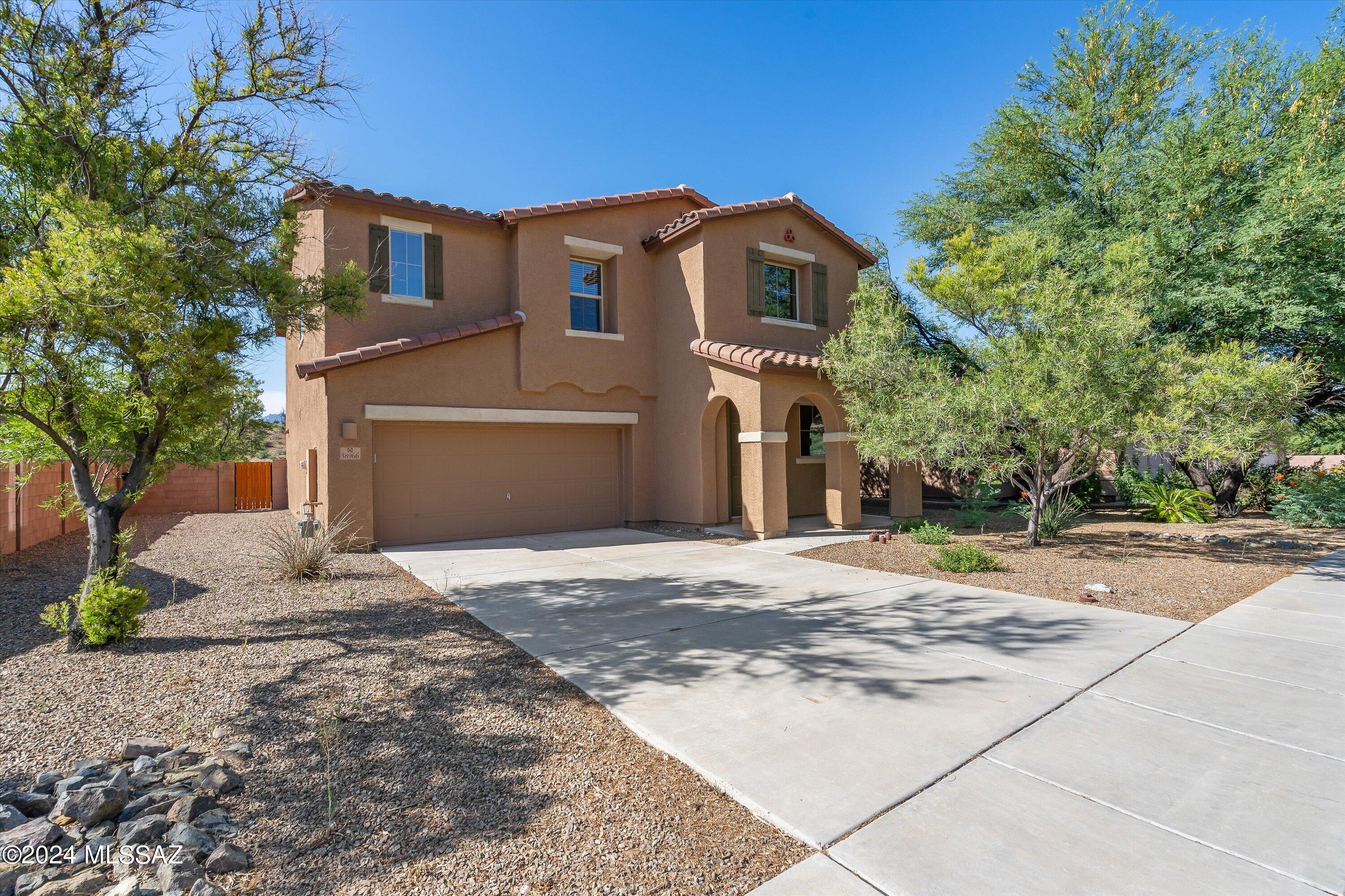 Welcome to 38966 S Running Roses Ln, a beautiful 4-bedroom, 3-bathroom single-family home nestled in the desirable Eagle Crest Ranch community in Saddlebrooke, Arizona. This impressive residence, built in 2013, offers 2,476 square feet of living space on a 6,534 square foot lot, providing ample room for comfortable living and entertaining.

As you enter, you are greeted by spacious and inviting living areas perfect for family gatherings. The modern kitchen is a chef's dream, equipped with stainless steel appliances, ample cabinetry, and a large island for meal prep and casual dining. The luxurious master suite serves as a private retreat with a walk-in closet and an en-suite bathroom featuring a double vanity and a large shower. Three additional bedrooms provide plenty of space for family, guests, or a home office, complemented by two full bathrooms with modern fixtures and a convenient half bath for guests.

The exterior of the home is equally impressive, with both front and rear yards designed for low maintenance with attractive, low-care landscaping. Enjoy breathtaking views of the surrounding mountains from your backyard, which is fenced with a block wall, providing privacy and security. The concrete driveway leads to an extended-length two-car garage.

Located in the highly sought-after Eagle Crest Ranch subdivision, this home is part of a vibrant community with amenities such as basketball courts and sidewalks. It falls within the Oracle School District, with Mountain Vista School serving elementary and middle school students, and Canyon Del Oro High School nearby. The home is also conveniently located near shopping, dining, and entertainment options in Saddlebrooke and the surrounding areas.

Additional features include zoned air conditioning and ceiling fans for year-round comfort, natural gas heating, and utilities connected to Trico Electric and Goldman Water. The community has an HOA with associated fees and CC&Rs to maintain the neighborhood's quality and appearance. Annual property taxes are approximately $2,301.

This stunning home at 38966 S Running Roses Ln offers the perfect blend of luxury, comfort, and convenience in a prime Saddlebrooke location. Don't miss the opportunity to make this beautiful property your new home. For more information or to schedule a showing, please contact the listing agent at (520) 342-9809 or the office at (520) 299-2201.