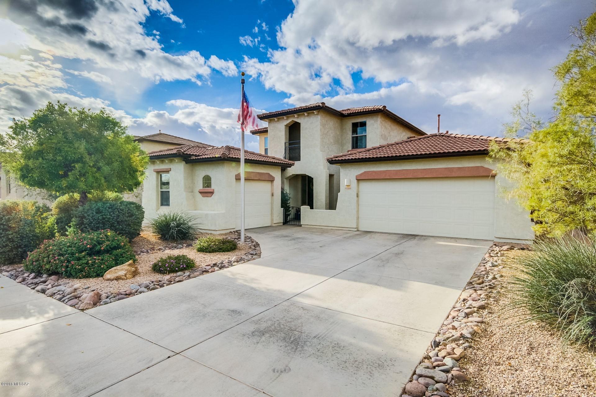 Seller will accept or counter offers between $275,000-$285,000. This immaculate, professionally-designed 2-story home invites comfort, and exudes elegance!  With 4 bedrooms, 3 baths, generous living space and stylish finishes, you'll enjoy a perfect setting for relaxing and entertaining!  Upon entering the home you are greeted with warmth and the familiar feeling of home.  The kitchen boasts tiled backsplash, breakfast bar, SS appliances, rich wood cabinetry, roll out shelves and plant shelving.  The spacious bedrooms consist of high end plush carpeting, open space and ceiling fans.  The generously sized master bedroom features arcadia doors that lead out to the back patio and tons of natural light.  The master bathroom comprises of a relaxing garden bathtub and a separate shower. The expansive covered back patio overlooks the  backyard filled with shade trees, water feature, decorative gravel and desert landscaping-an ideal setting for resting after a long workday! Located in Gladden Farms, close to parks, walking trails, bike paths and the Splash Pad. Look no further!  Book your showing today!  This home is everything you've been dreaming and more!  Your dream home awaits! Drive Times to Raytheon - 38 mins, 
Caterpillar - 27 mins, University Of Arizona - 28 mins, 
Honeywell - 27 mins and Ventana Medical - 25 mins.