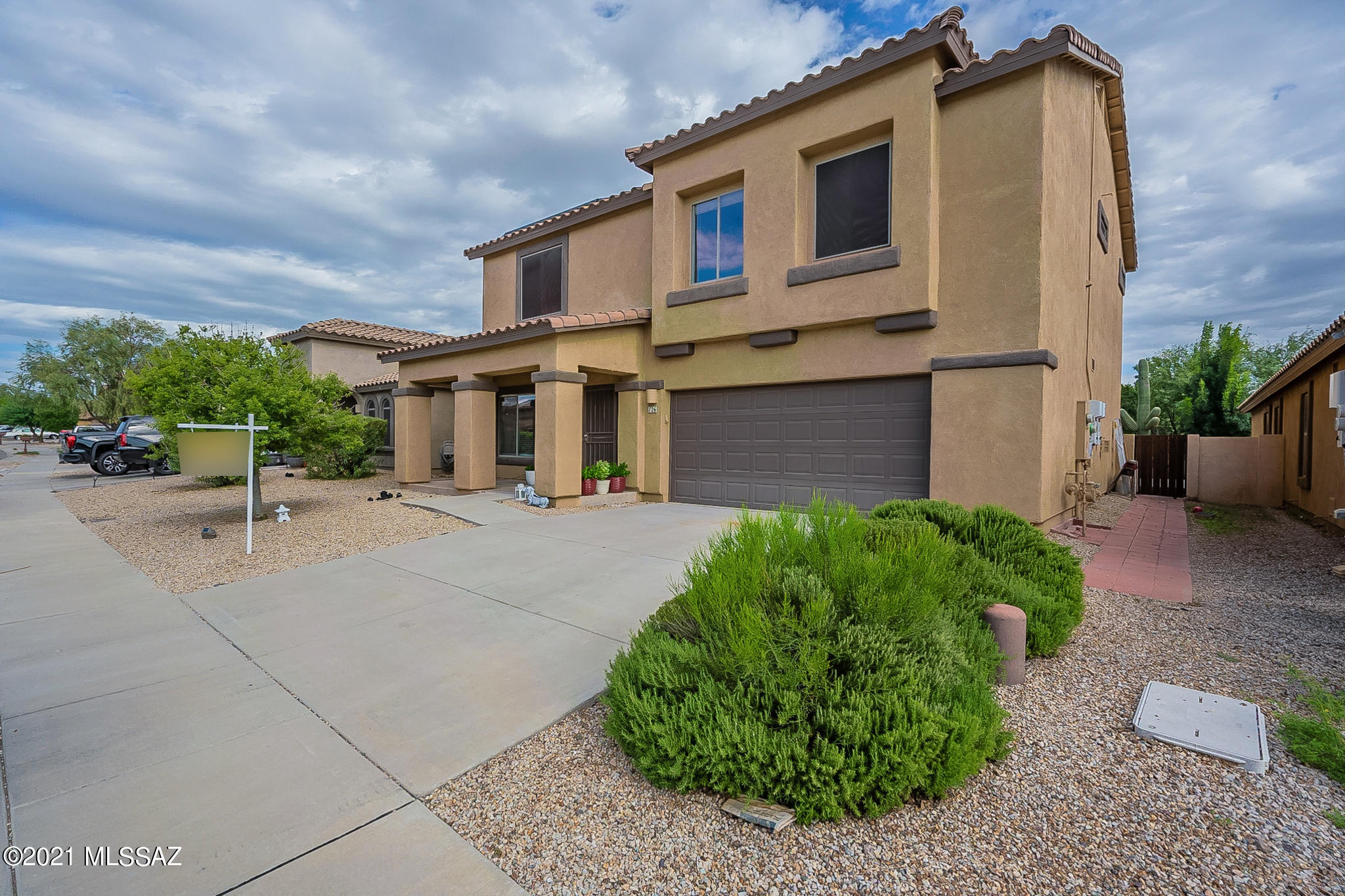 BEUATIFUL 2 story home in Award Winning Master Planned Community of Rancho Sahuarita!!! This home features ceramic tile floors on main level and newly layed engineered wood laminate throughout second floor and stairway. The kitchen features black appliances, gas range, farm sink, maple cabinets, breakfast bar and large pantry closet. The kitchen opens to dining area and greatroom w/gas fireplace and movie projection screen/equipment. Upstairs features 4 bedrooms plus large loft area, built in desk area w/cabinets. Upstairs laundry room w/ cabinets, Upstairs baths feature dual vanities, master has walk in shower and walk in closet. Master sliders open to upper balcony that overlooks   GORGEOUS landscaped backyard which includes a pergola, raised planter beds, and full lenth covered patio. As well as artificial turf area and expanded uncovered concrete patio area with lots of room for entertaining. Ceiling fans and blinds throughout home as well as installed alarm system, soft water loop in garage, and leased solar system. No rear neighbors and within walking distance to park and community swimming pool.
A truely must see!!! Don't miss out on this one!!!