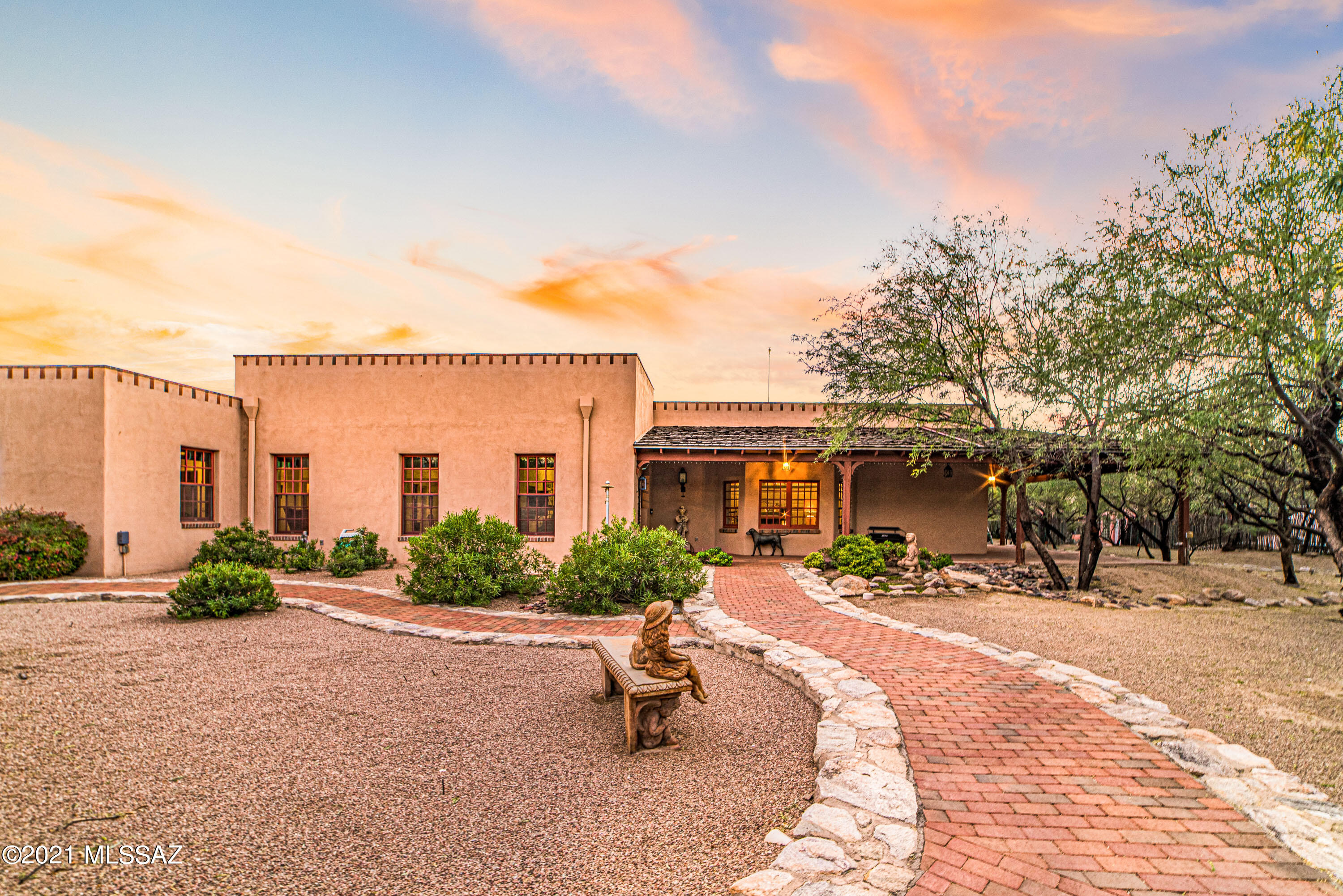 Private sanctuary in the heart of Historic Ft Lowell District & never before on market this incredible custom home is tucked inside a courtyard & crafted of the finest materials w/extensive curated antiques from the later 1700's/early 1800's: gleaming wide-plank pine flooring reclaimed from Early American New England homes, 2 authentic fireplaces installed intact from early Mass taverns, reconstructed bar from the same era, open kitchen w/exposed brick, antique wood beamed ceilings & cherry wood cabinets, charming blown glass bay window, formal dining w/custom chandelier & French doors leading to deep wrap around porch, generous primary suite w/separate showers, closets & vanity areas, TRULY INCREDIBLY SPECIAL!! SEE DOCUMENTS.