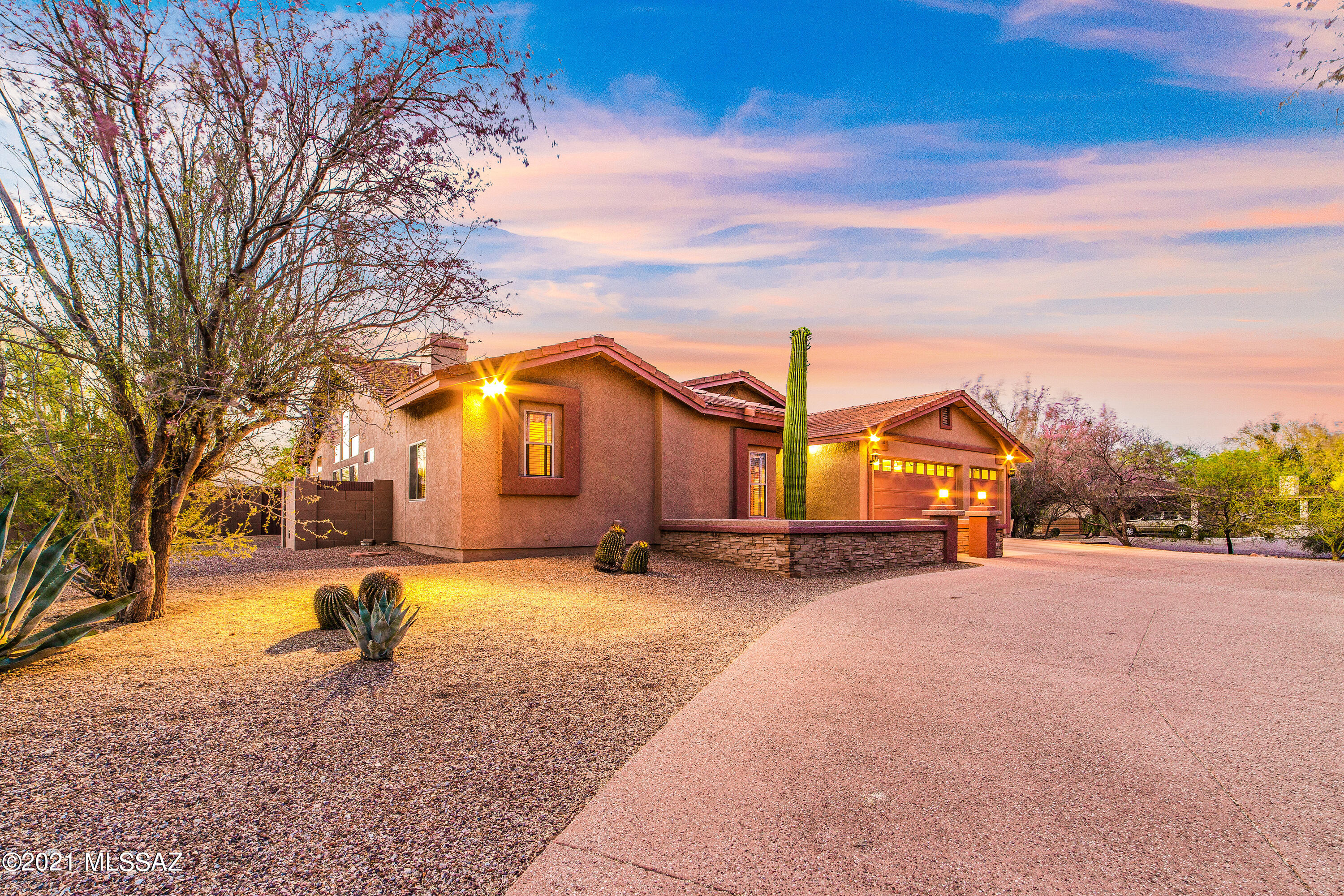 SELLERS SHALL ACCEPT OR COUNTER OFFERS BETWEEN $750,000-$795,000. Stunning custom home on a large 1.09 acre lot w/it's own Professionally designed chip & putt golf course. This 4 BD/3 BA/2,692 Sq.Ft/3 Car Garage contemporary home has an inviting floorplan and backyard one could only dream of.  NEW 50 year roof '16, NEW AC '16, NEW water heater '20 & much more. Floorplan offers living area, formal dining, family room w/gas fireplace, causal dining & chef's kitchen. Kitchen has NEW cabinets '20, tile counters, black stainless steel appliances & gas stove hookup available. Master suite is spacious w/slider to patio, separate dual vanities, tub, shower & walk-in closet. Backyard is truly one of a kind with its own chip & putt 18 hole golf course, large extended patio, fenced pebble..... ....tec pool/spa w/solar heating & hot tub, large grass area, workshop w/ac & mural painted by famous artist Joe Pagac, mature landscaping & trees w/drip & firepit. Room to park a boat or toys with double side gate. Large extended 3 car garage w/storage. Half circular aggregate concrete driveway, lush desert landscaping & courtyard finish off the entry to this home.