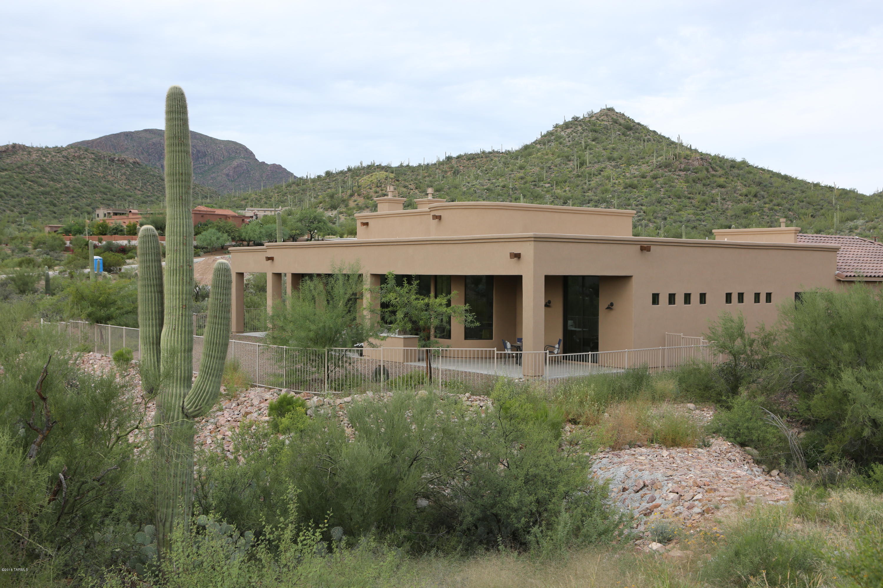 Embraced by the Tucson Mountain Wilderness Park and boundless amenities at your doorstep, this custom luxury home will be irresistible to the most discriminating buyer. Golf, play tennis, swim, hike, practice yoga or pamper yourself at the spa. Everything you love can be enjoyed at Starr Pass. Situated on a prime building site within the gated enclave of Wildcat Pass, find yourself surrounded by natural saguaro studded beauty and solitude of the Sonoran Desert. Yet the nearby vibrant downtown scene beckons with the glimmer of city lights from your great room and patio. World Class JW Marriott Resort, Hashani Spa, and Country Club, deliver Resort living at its finest. View the 3D Tour, Floor Plan, Amenities. Full Golf membership included. One owner of sellers equity is licensed AZ Realtor.