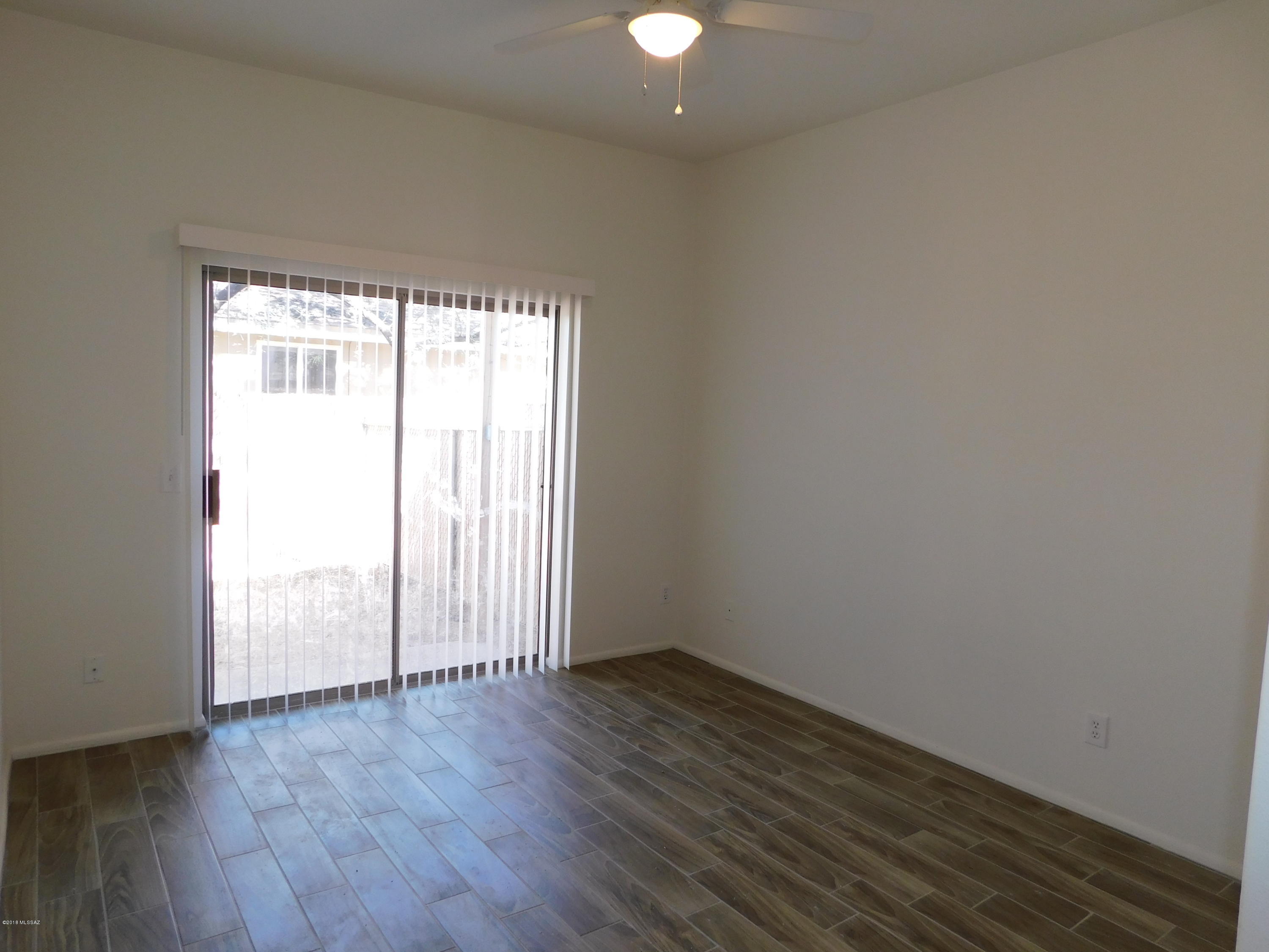 This two bedroom two bathroom home has been completely redone with new wood grain ceramic tile floors throughout the home, thick real granite counter-tops in the kitchen and both bathrooms. Upgraded to stainless steel appliances in the kitchen, ice maker in the refrigerator. Modern painted cabinets and brand new energy efficient LED lighting. This home has been updated with a contemporary modern style. No need for you to get quarters and go the laundry mat washer and dryer is include and located off the kitchen. Storage galore in this one; lots of cabinet space, full pantry, and exterior storage room. Centrally located so you are close to many great shopping, dining and transportation needs, with quick access to downtown and the freeway. No Back yard.